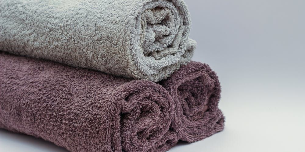 Grey Towel And Two Purple Towel