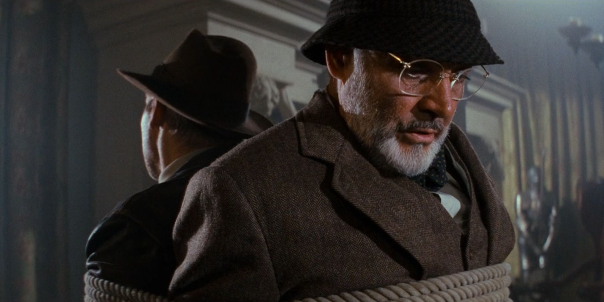 Indiana Jones and the Last Crusade Henry Jones Sr and Indy are tied together while sitting in chairs