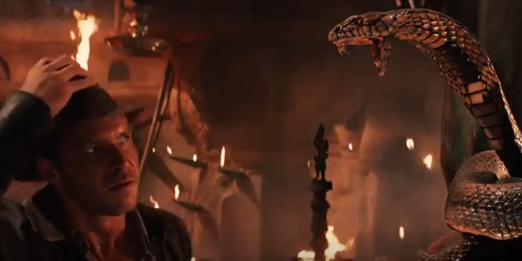 Indiana Jones: Temple Of Doom - Indiana Glaring At A Cobra Statue