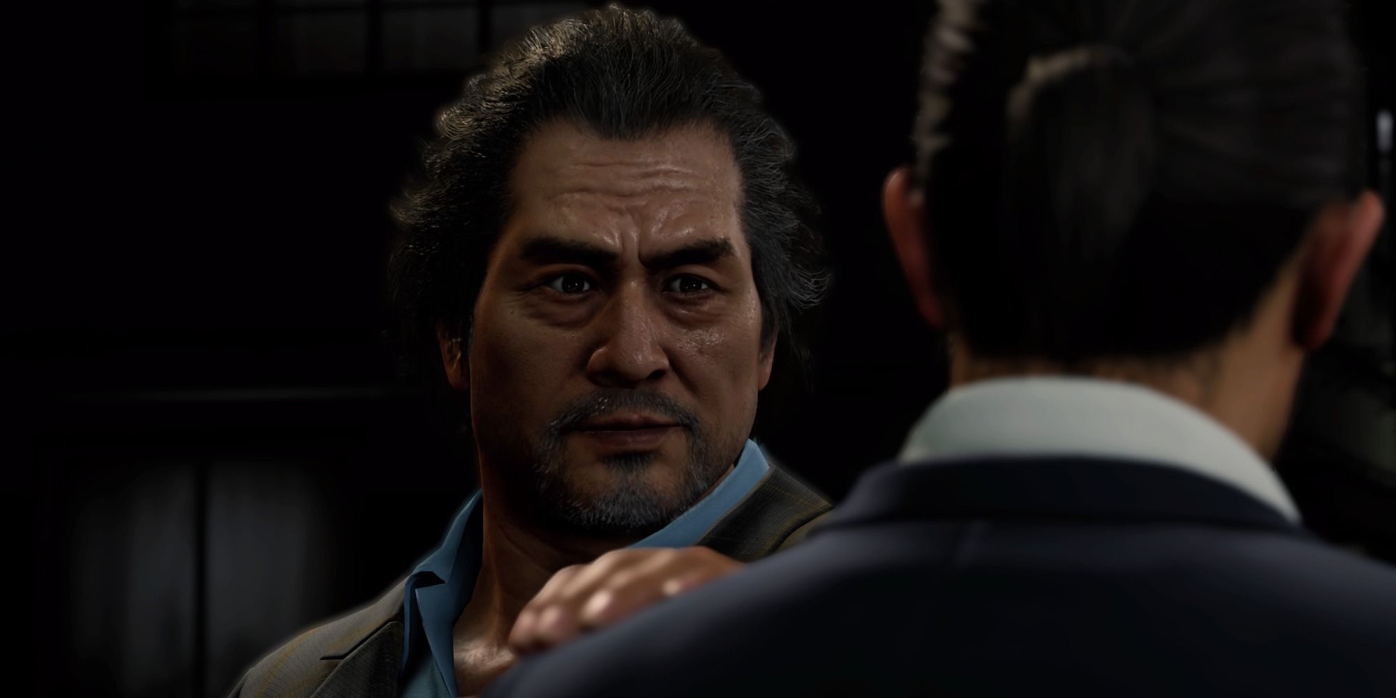 Koichi Adachi putting his hand on Kasuga's shoulder