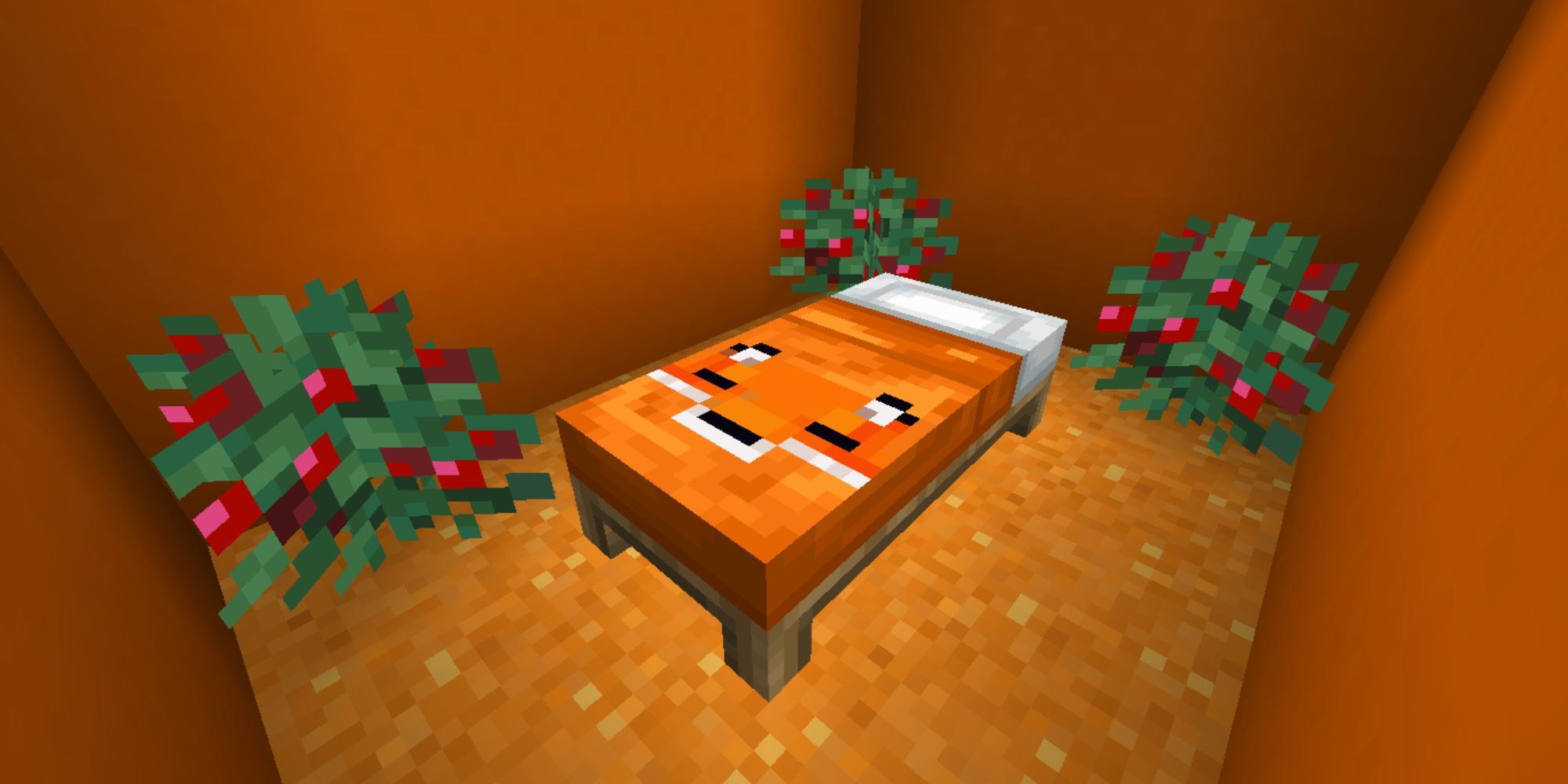 An orange, fox-themed bed with a white pillow in a small room with sweet berry bushes inside.
