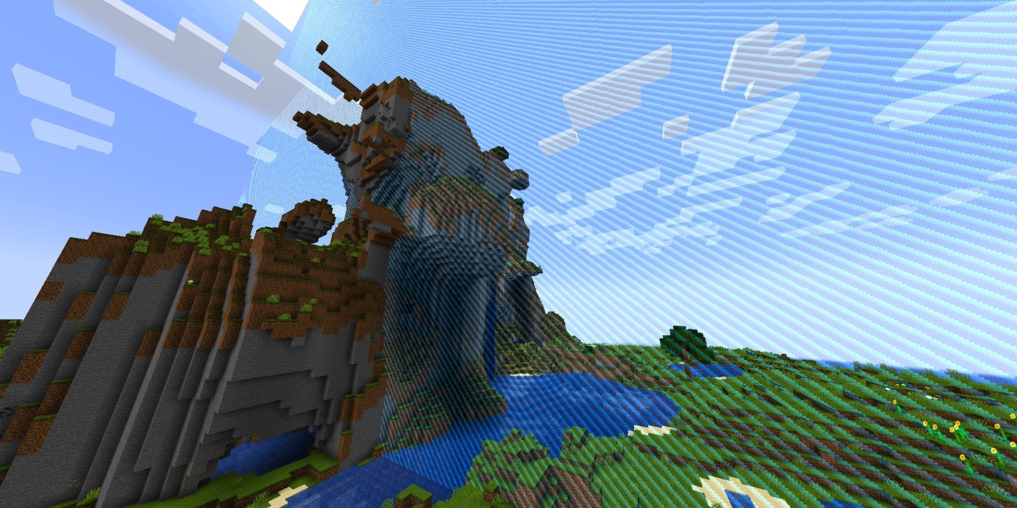 A mountain effectively cut in half by a blue, striped world border.