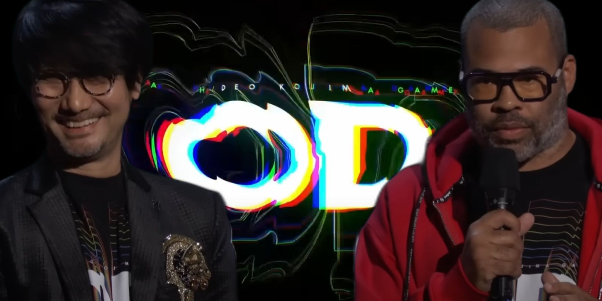 Jordan Peele with a microphone standing beside Hideo Kojima as part of their presentation at the Game Awards, the OD title reveal from the trailer behind them.