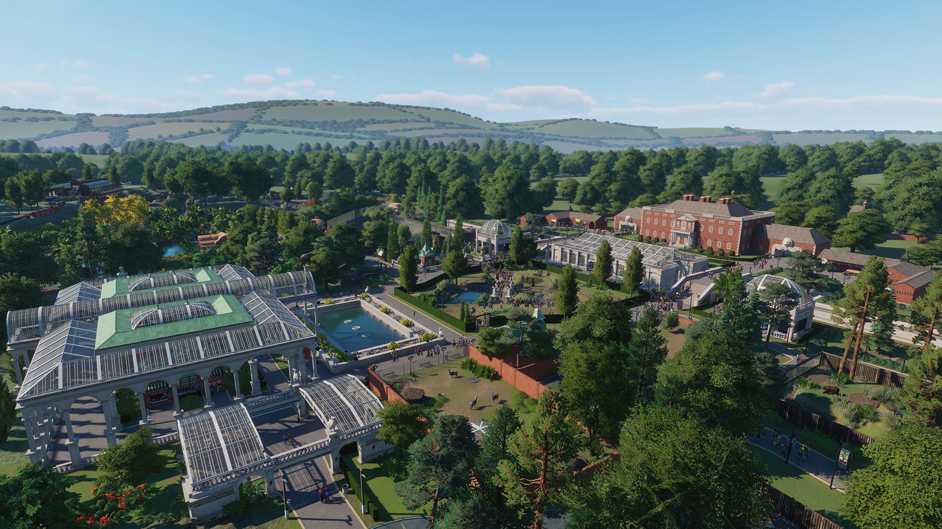 An aeriel shot of a park in Planet Zoo, showing a lot of greenery 