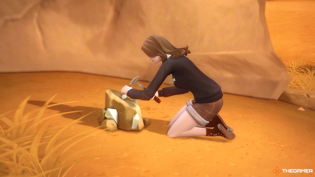 A Sim digs up a rock in Oasis Springs