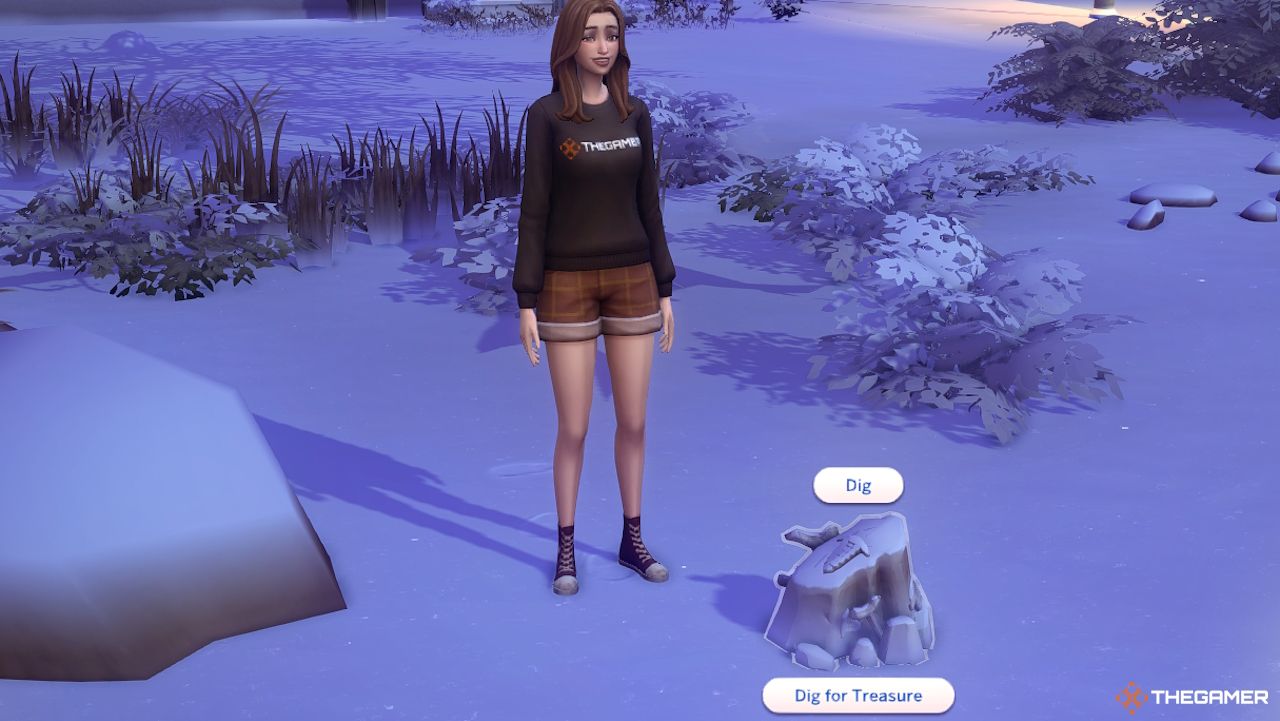 A Sim is able to dig a rock in the snow in Sims 4