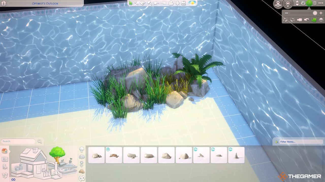Decorating underwater in The Sims 4 using rocks and plants