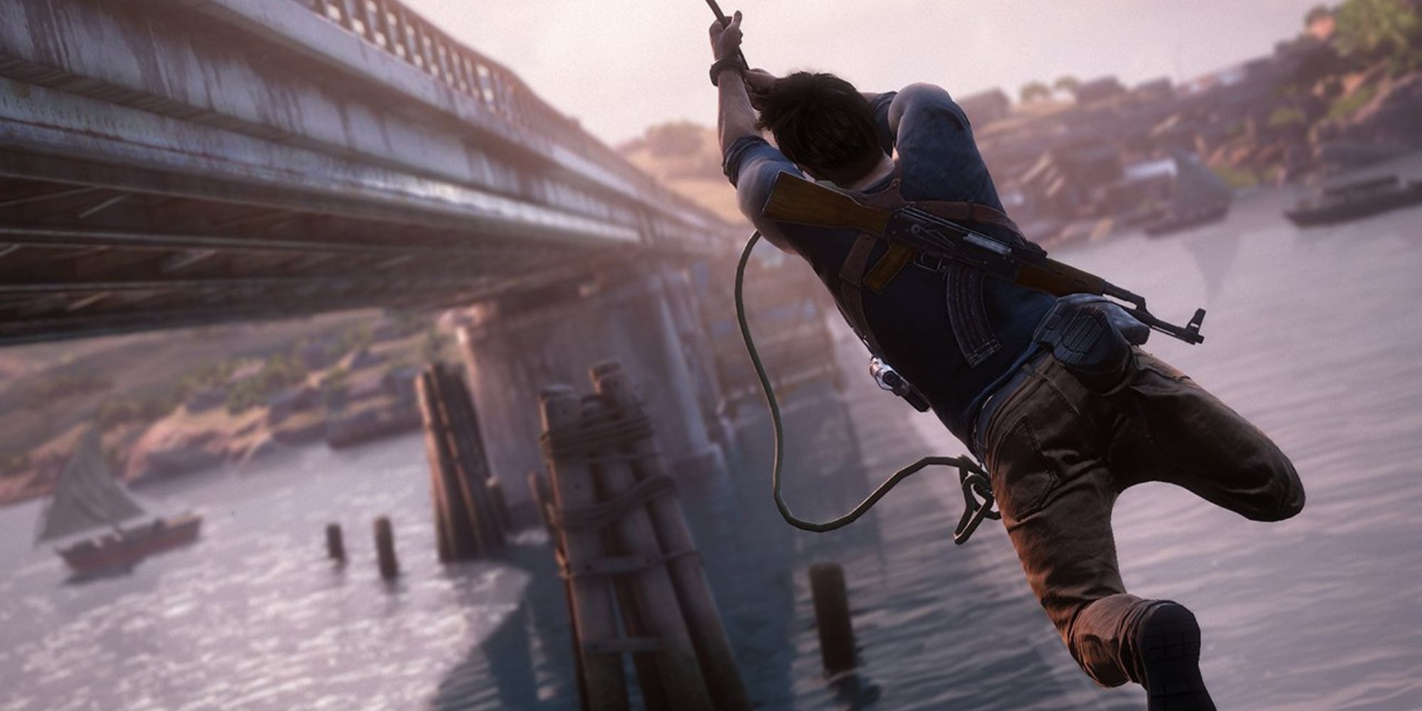 Nathan Drake swings toward a bridge