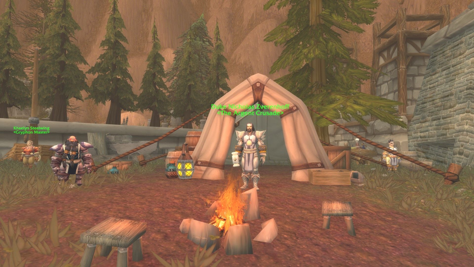 Duke Nicholas Zverenhoff in front of a tent and behind a campfire, with a few dwarves scattered near him