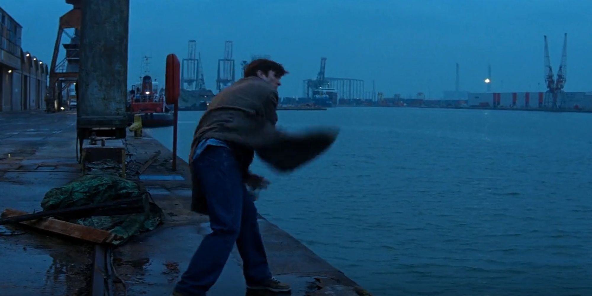 Batman Begins: Bruce Wayne Tossing His Gun Into Gotham River