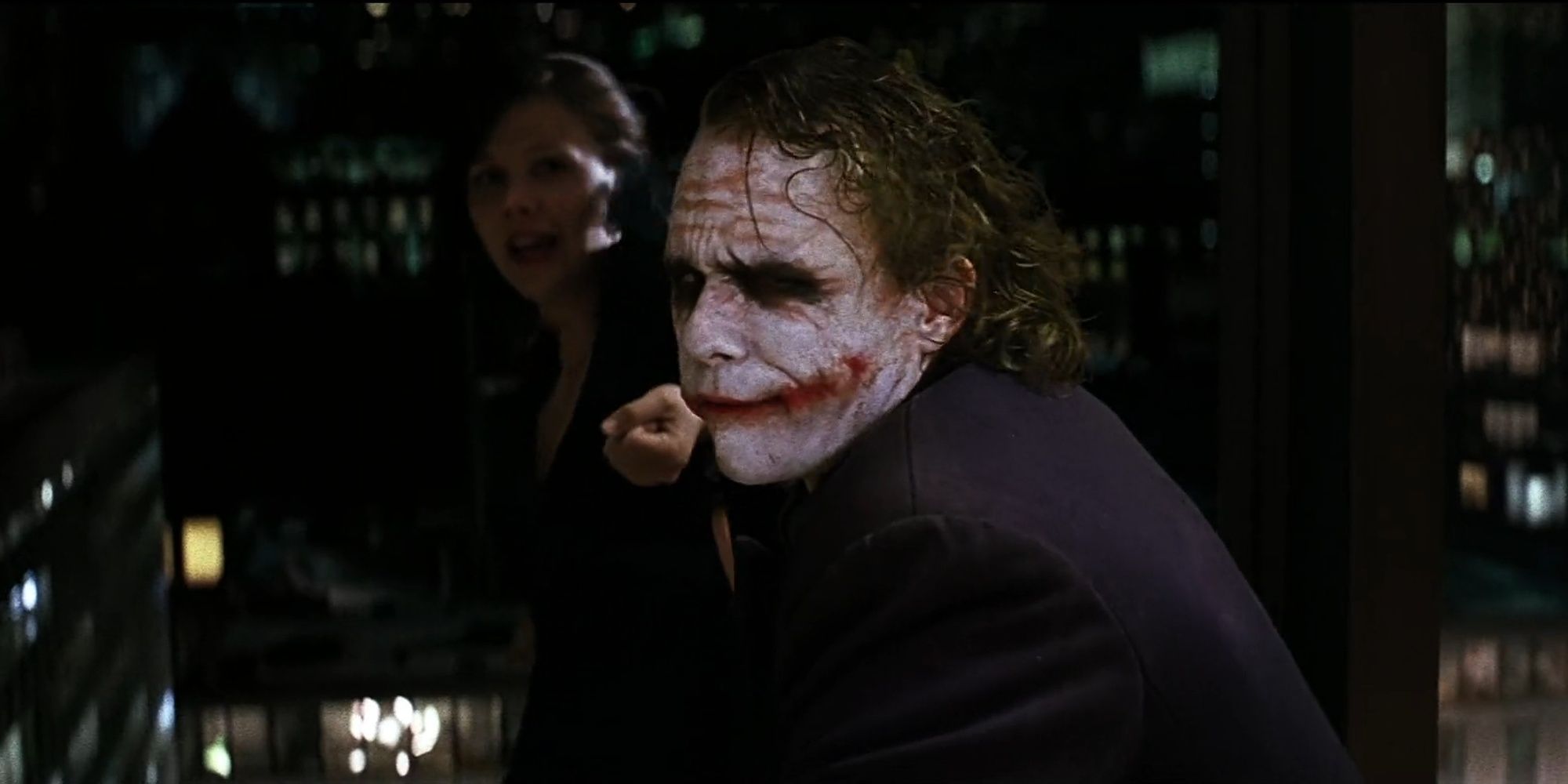 The Dark Knight: The Joker Letting Go Of Rachel As She Falls Out Of A Window