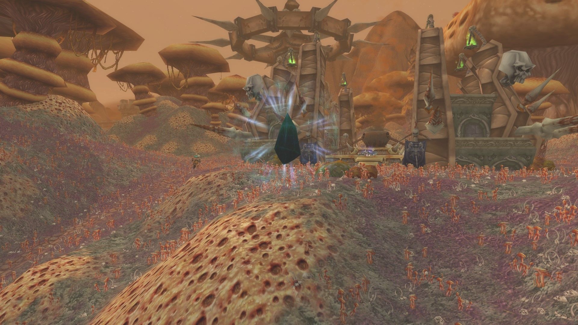 The Revealed Portal to Naxxramas, which is a floating dark green crystal in front of a Scourge structure in the Plaguewood