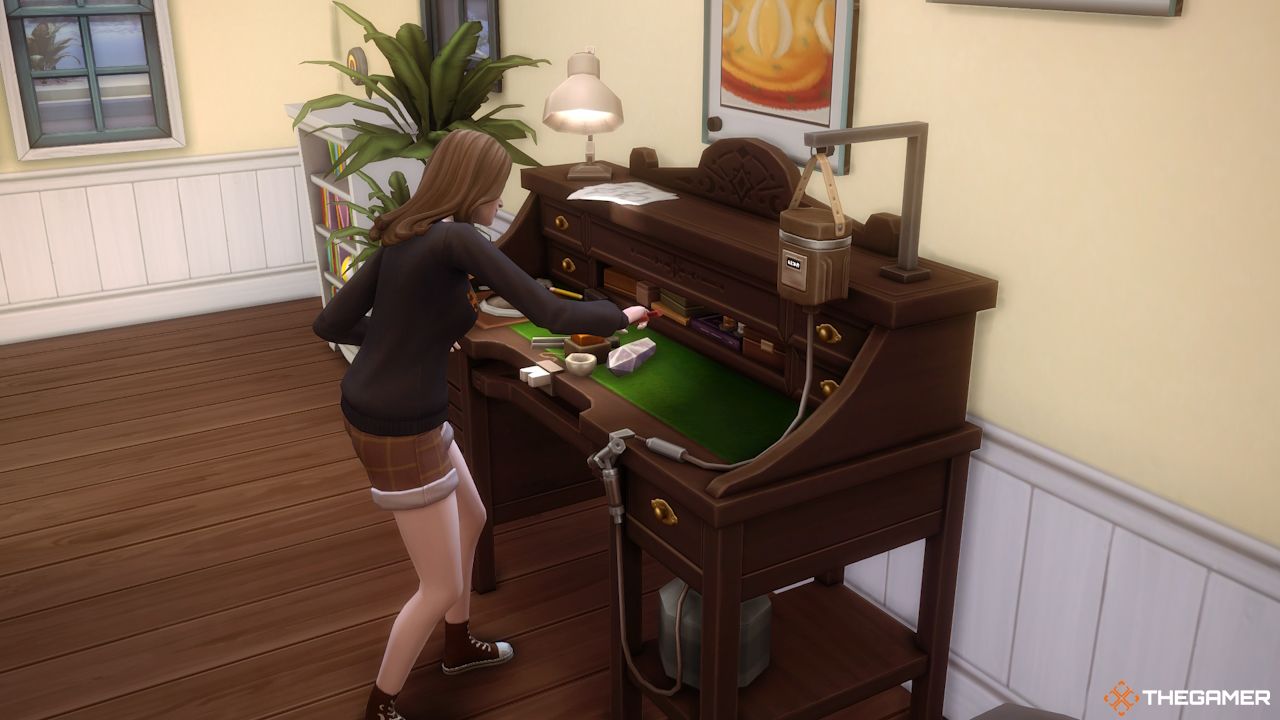 A Sim works at the Gemology table in Sims 4