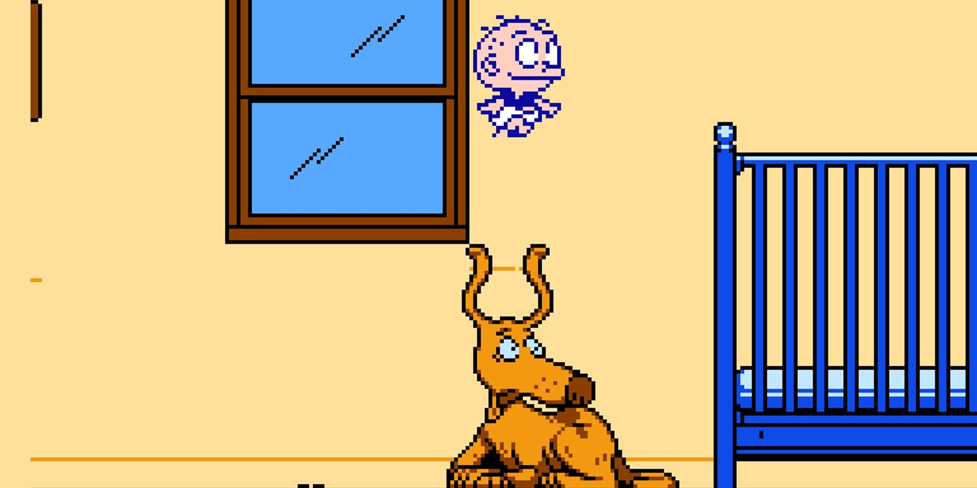 Tommy Pickles jumping over Spike the dog in the 8 bit version of Rugrats Adventures in Gameland