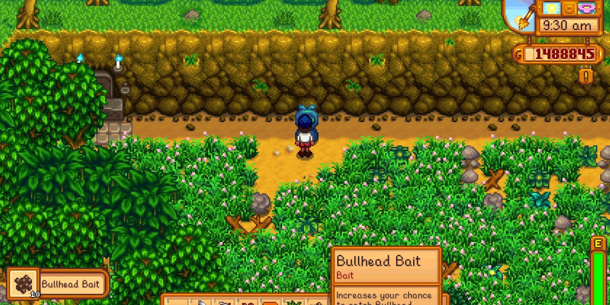 A character operating the bait maker in Stardew Valley.