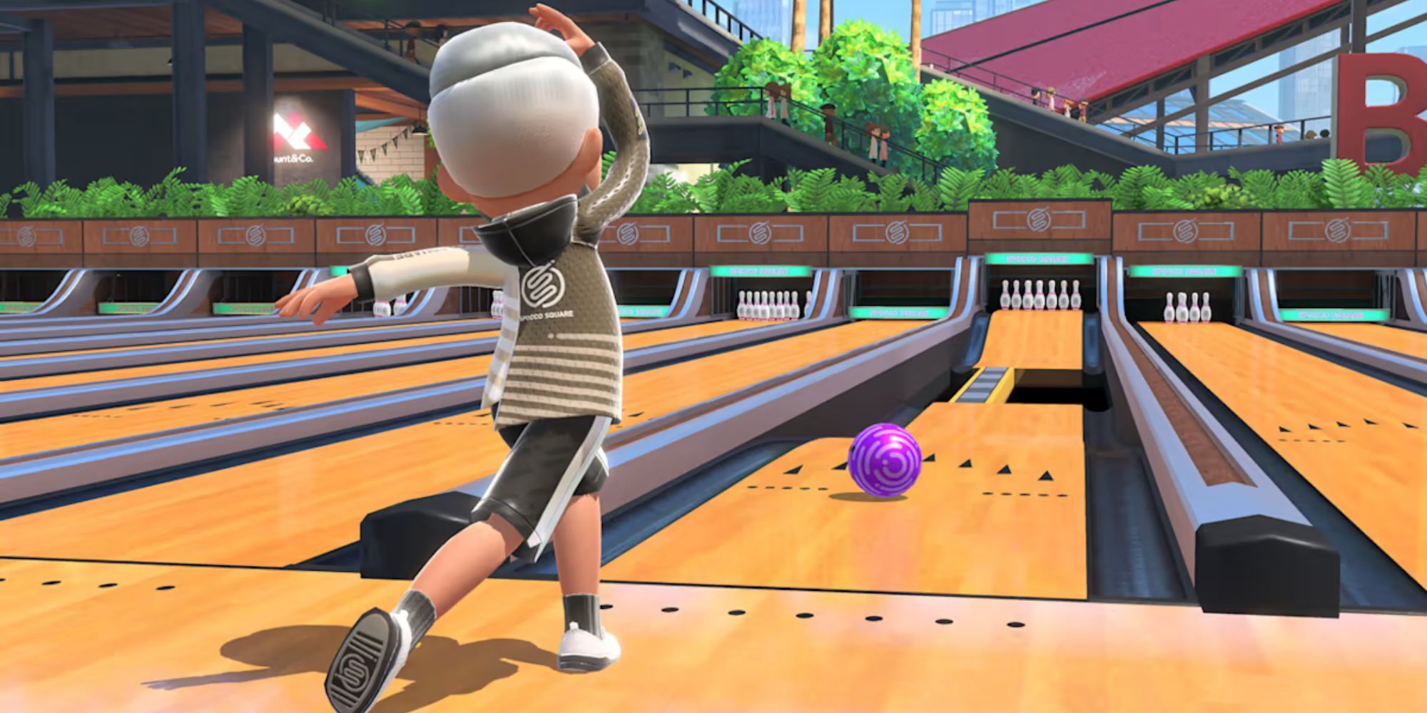 A Mii throws a purple bowling ball in Nintendo Switch Sports.