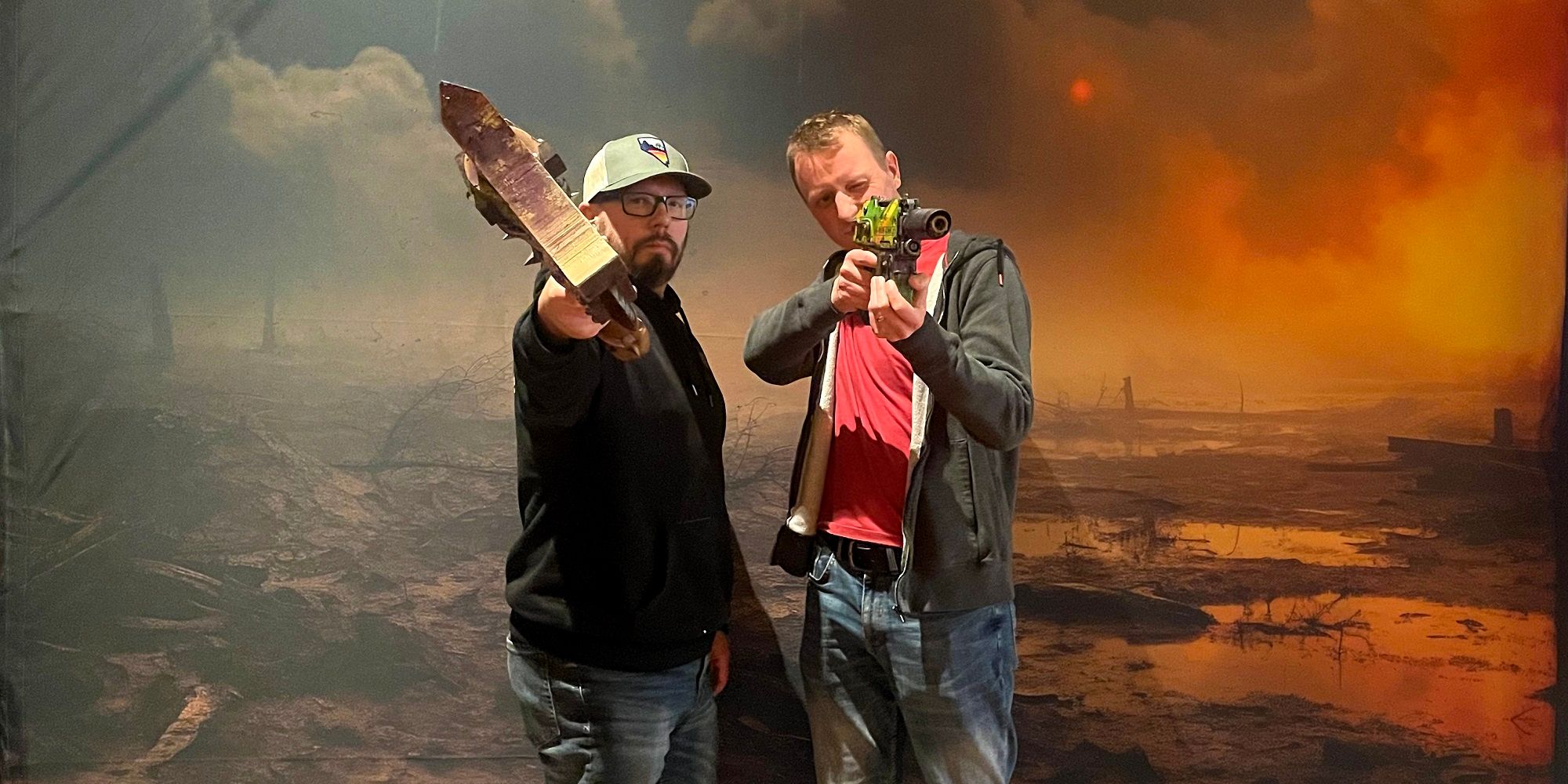 roger yates and duncan rhodes wielding a science fiction axe and pistol respectively