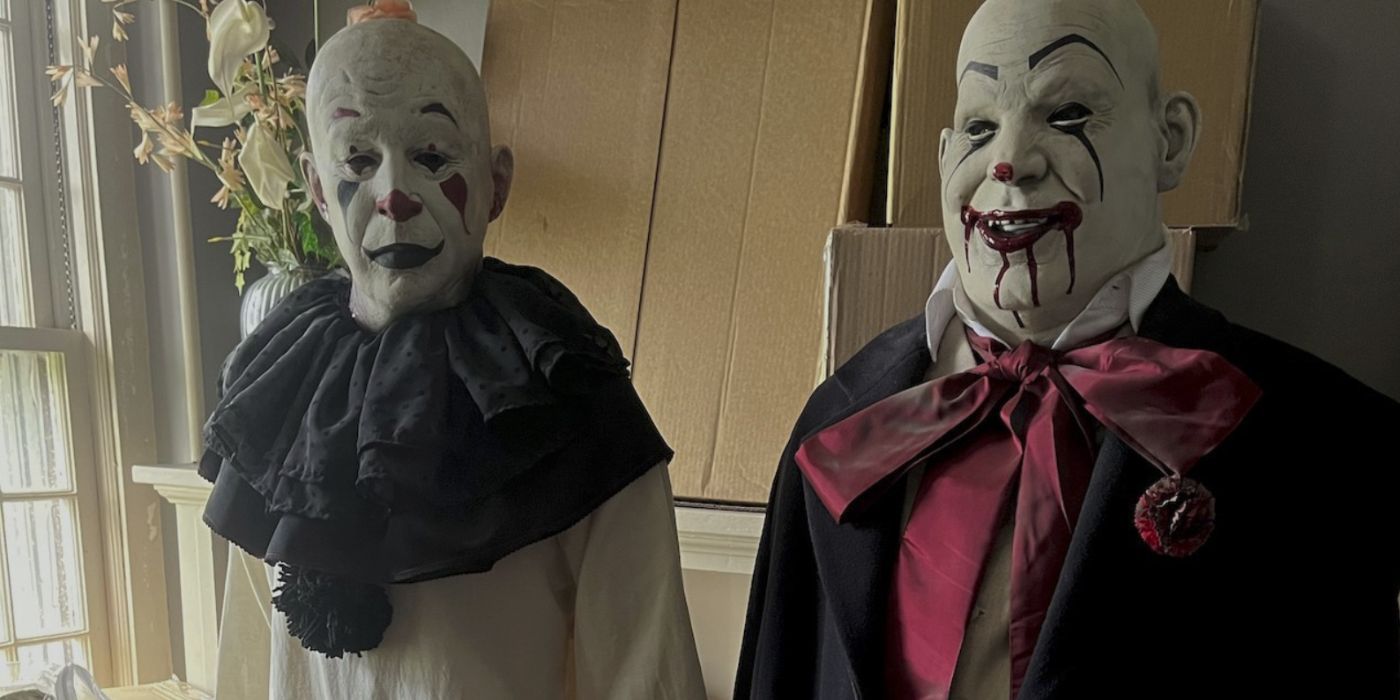 Two clowns, props for the haunted house, are set up next to each other.