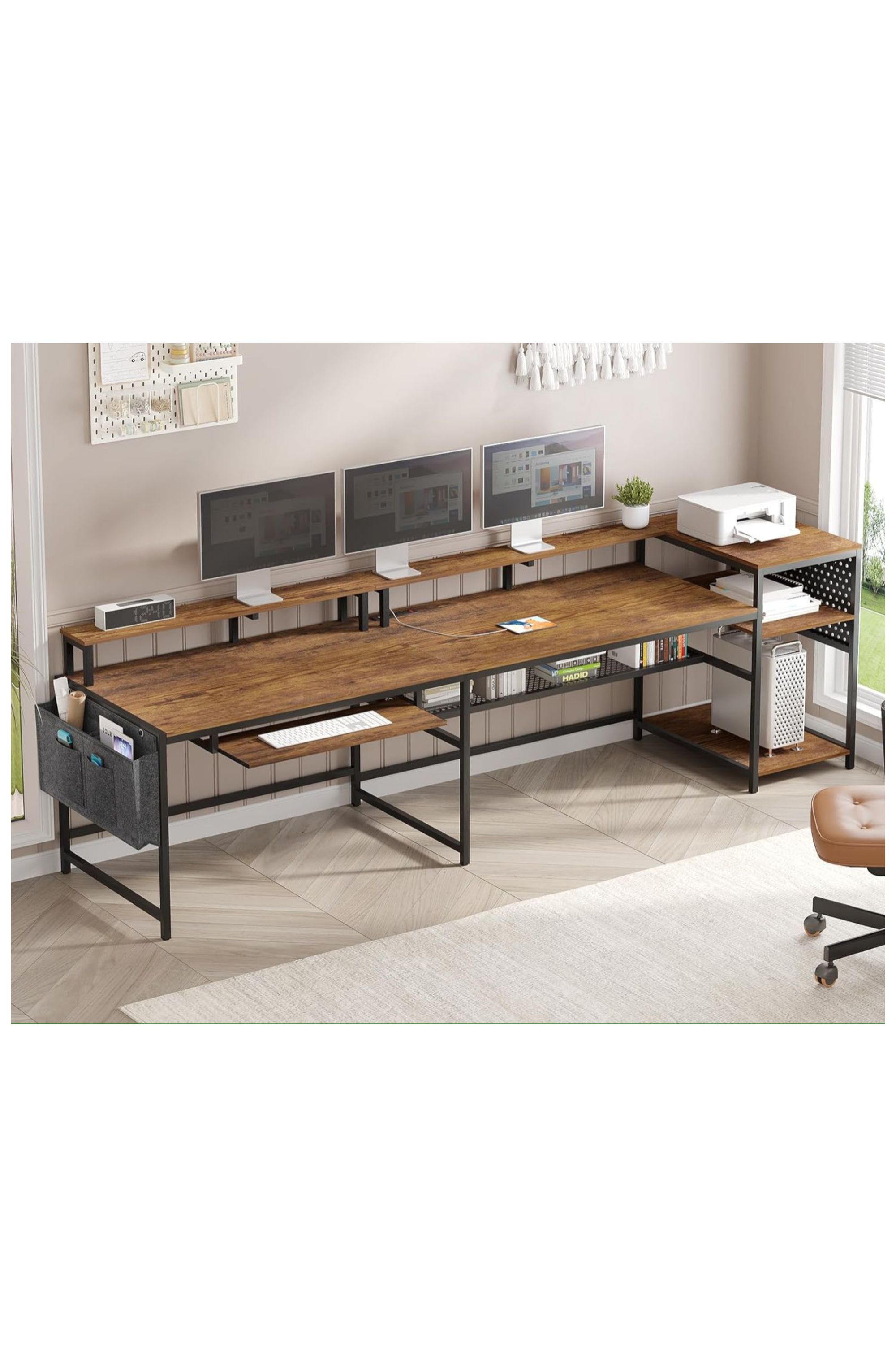 A large Sedeta desk with three displays and room for two chairs.