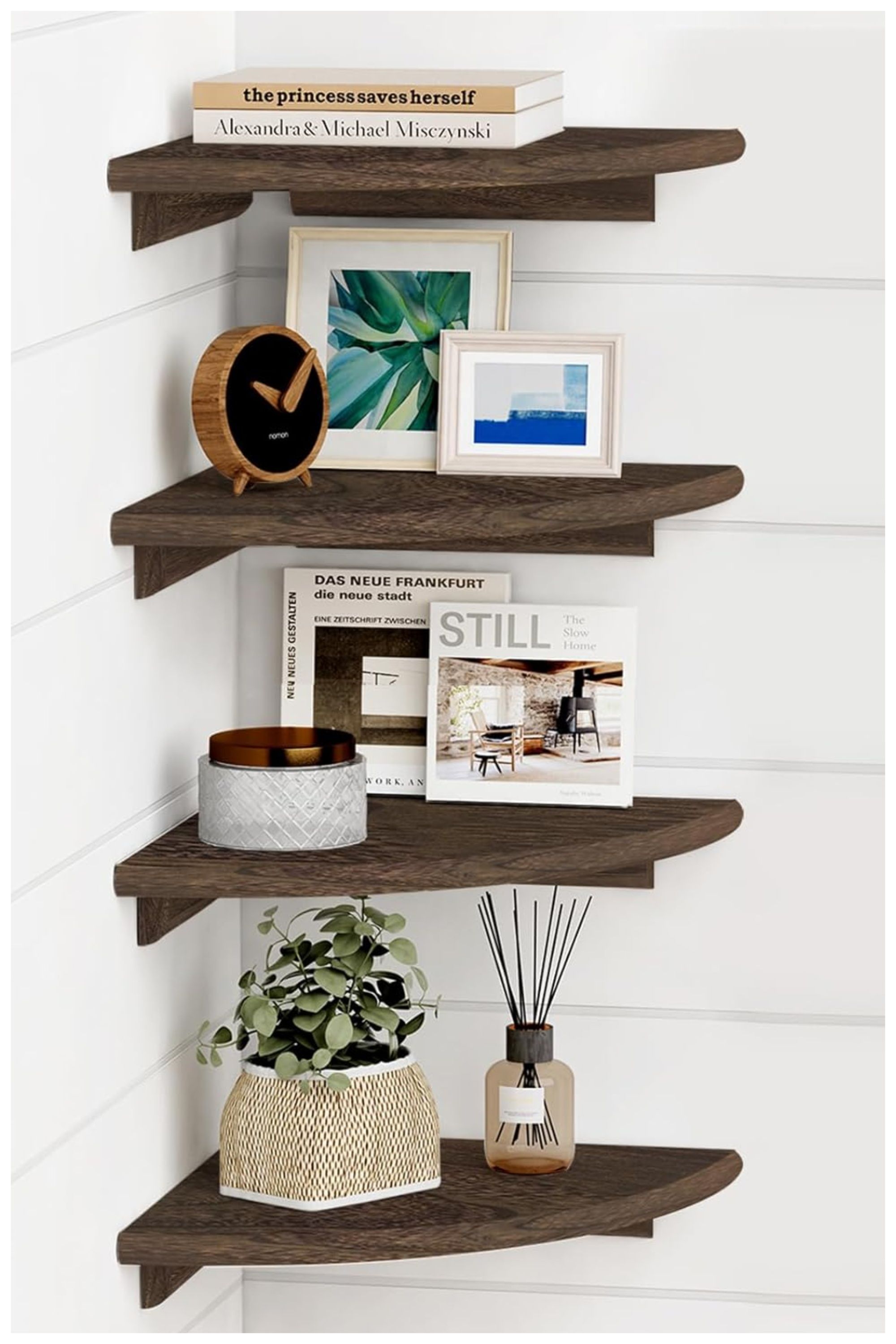 Four rustic wooden floating shelves attached to the corner of a white wall.