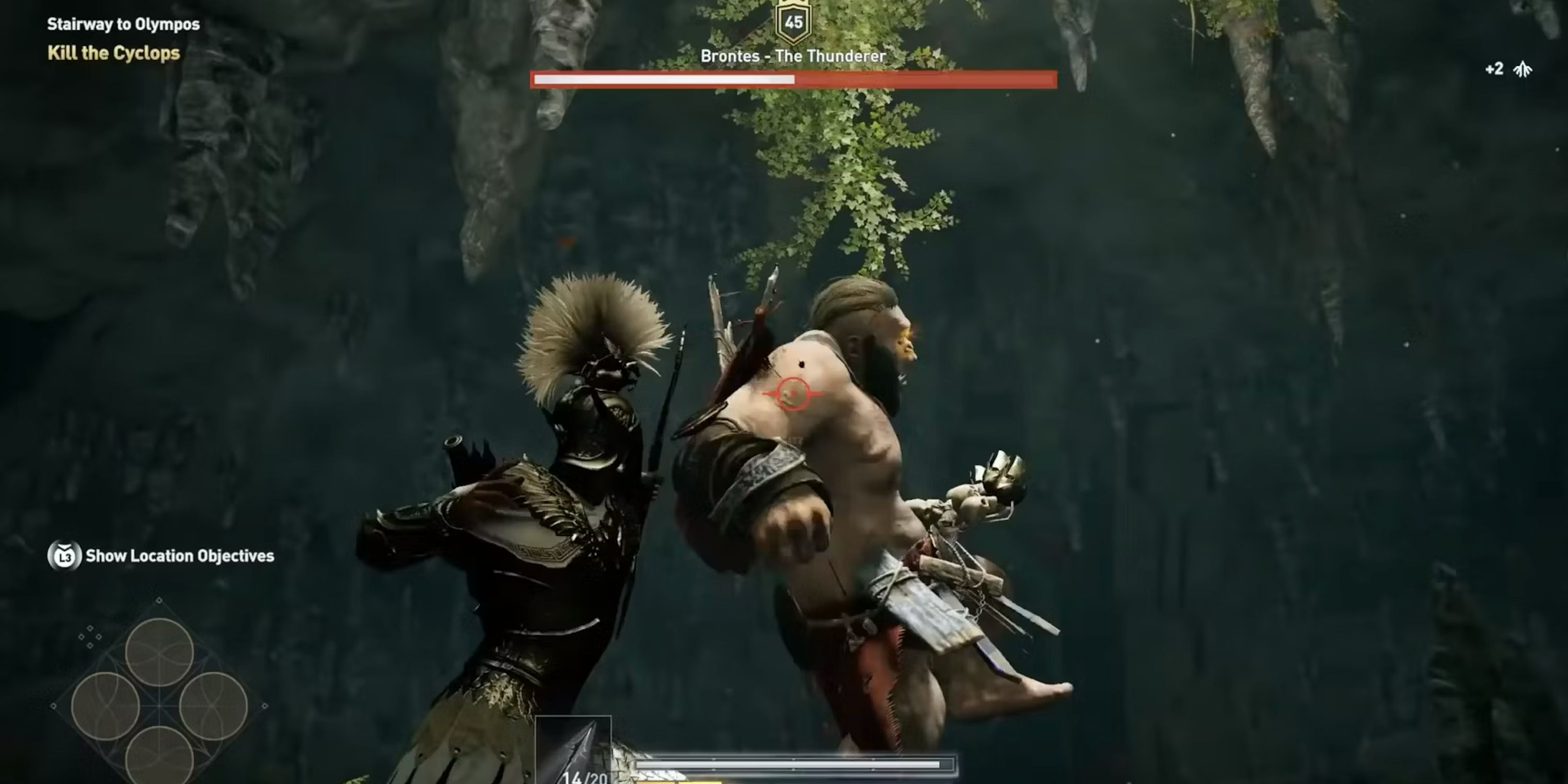 Player attacking a cyclops inside a cave from Assassin's Creed Odyssey