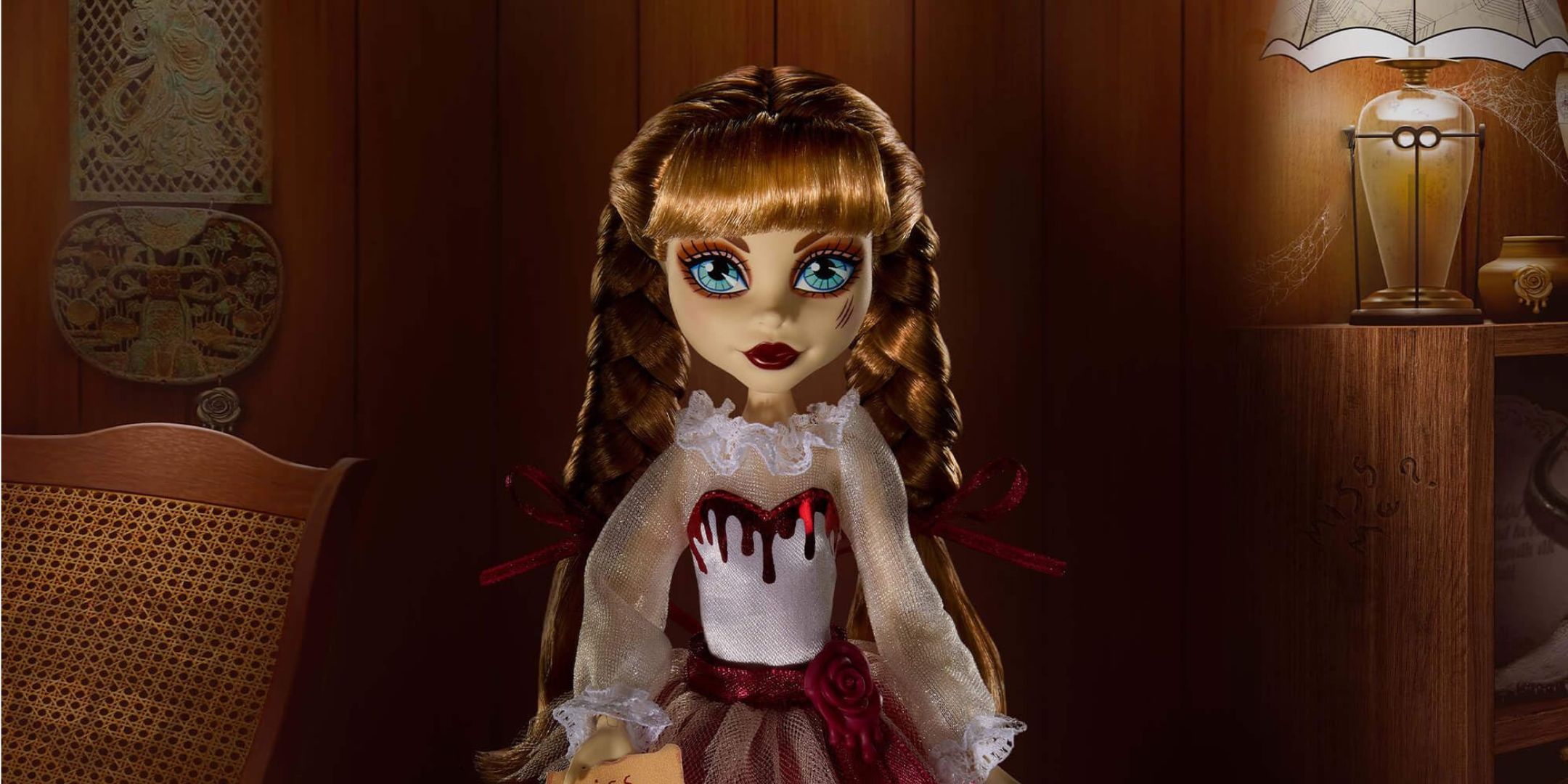 Annabelle doll against a dark wooden background