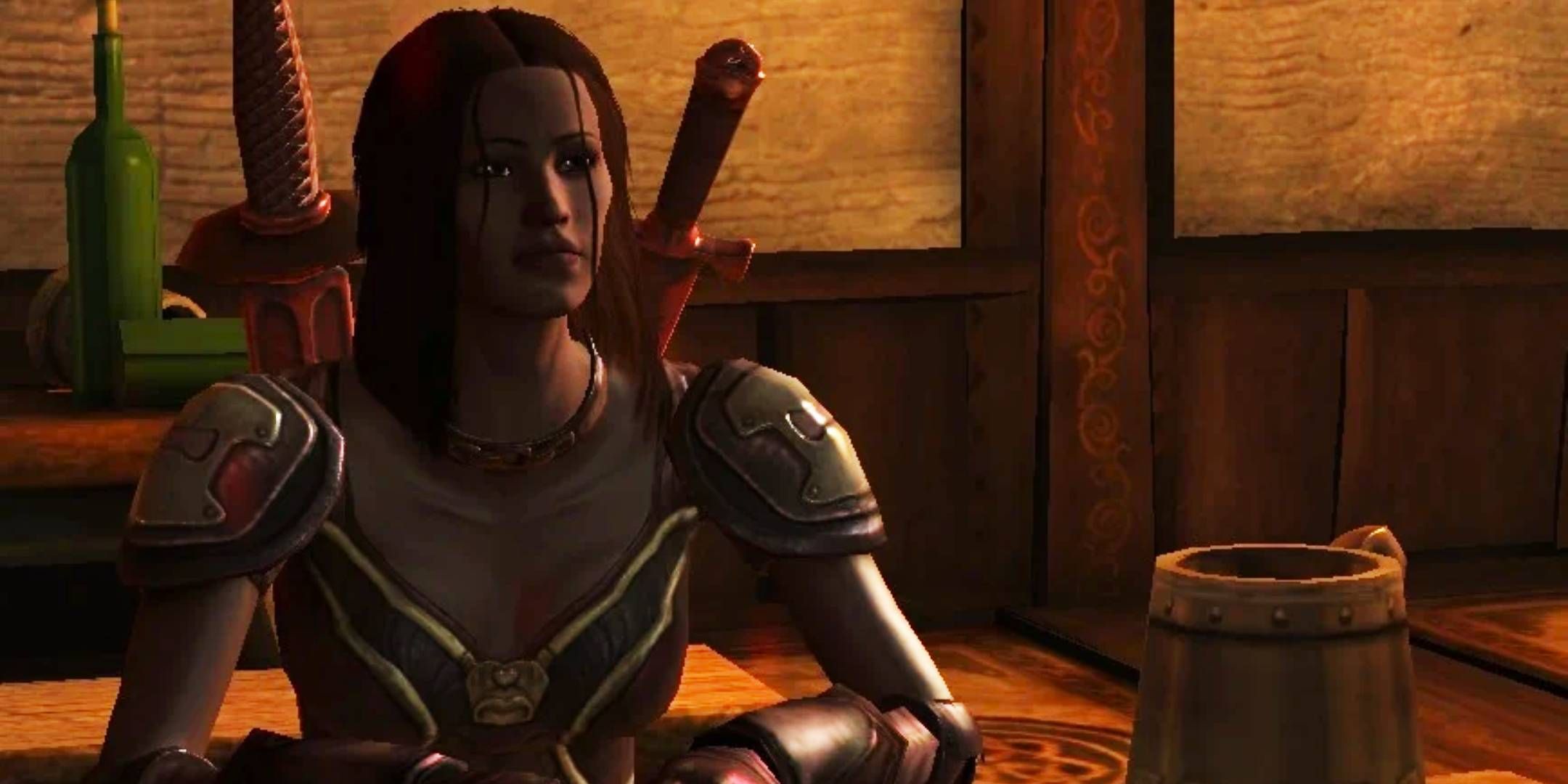Dragon Age Origins - Isabela sitting at a bar table