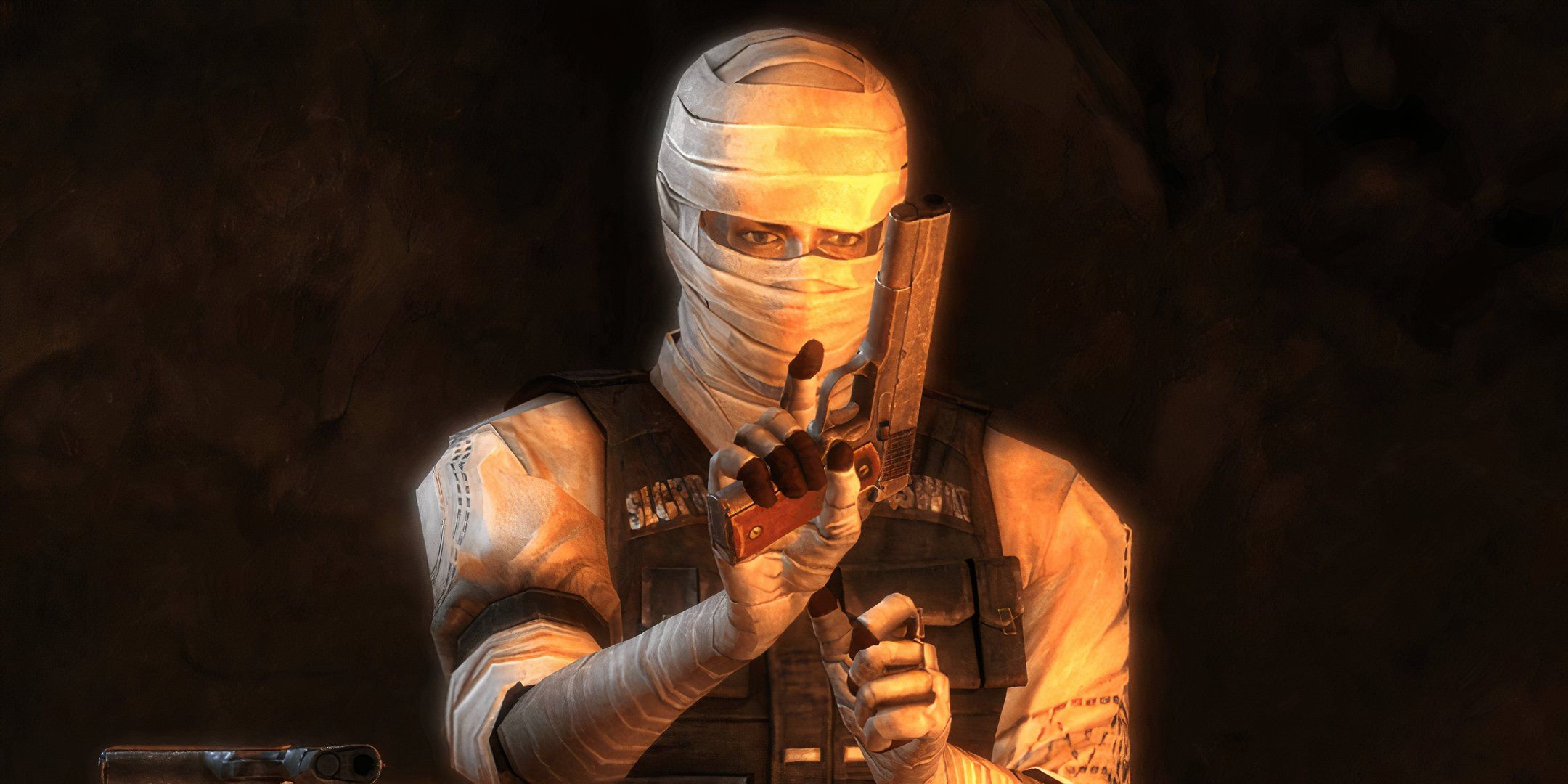 A man in bandages holding a pistol in Fallout: New Vegas