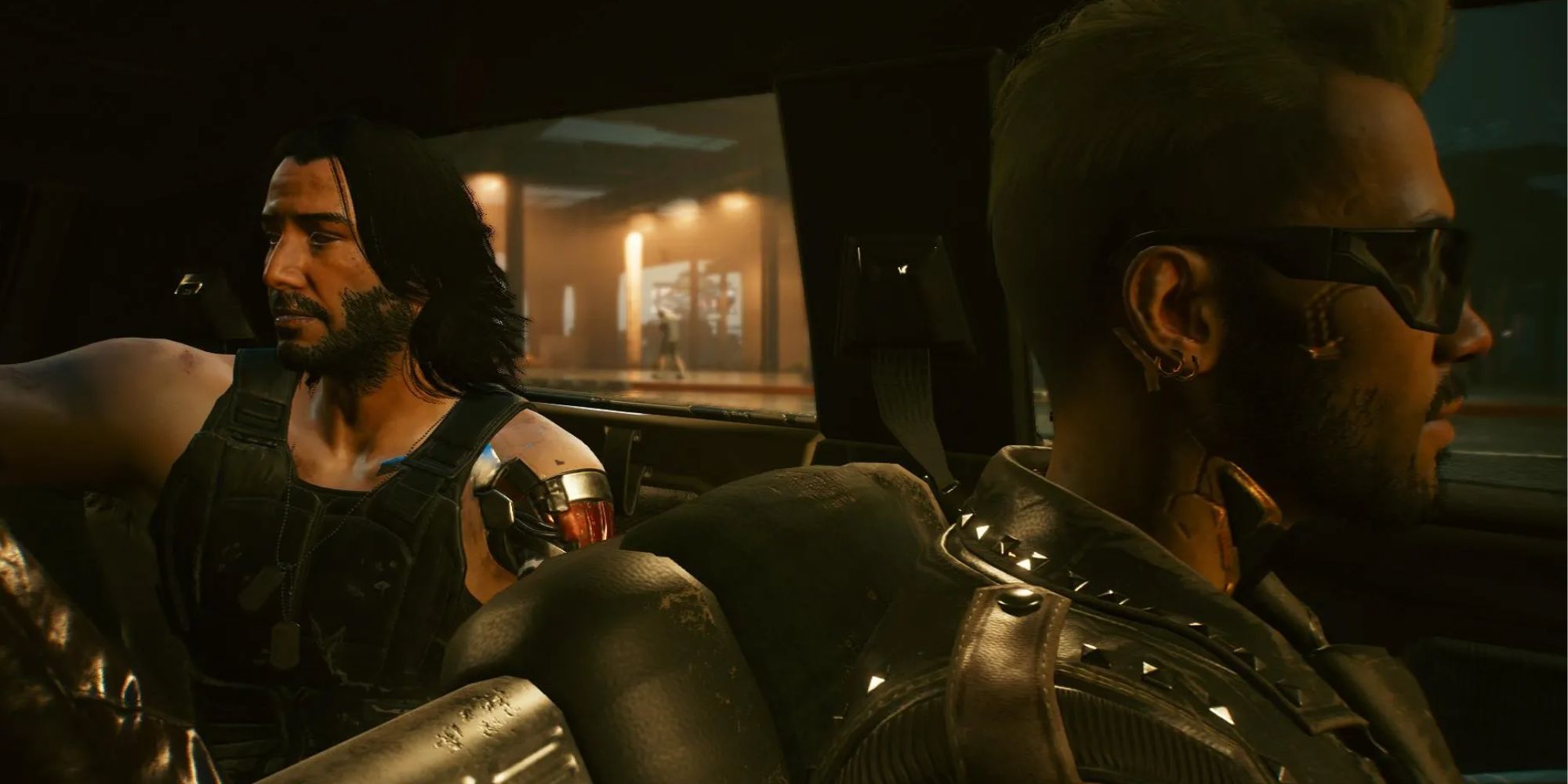 Kerry driving while Johnny sits in the backseat