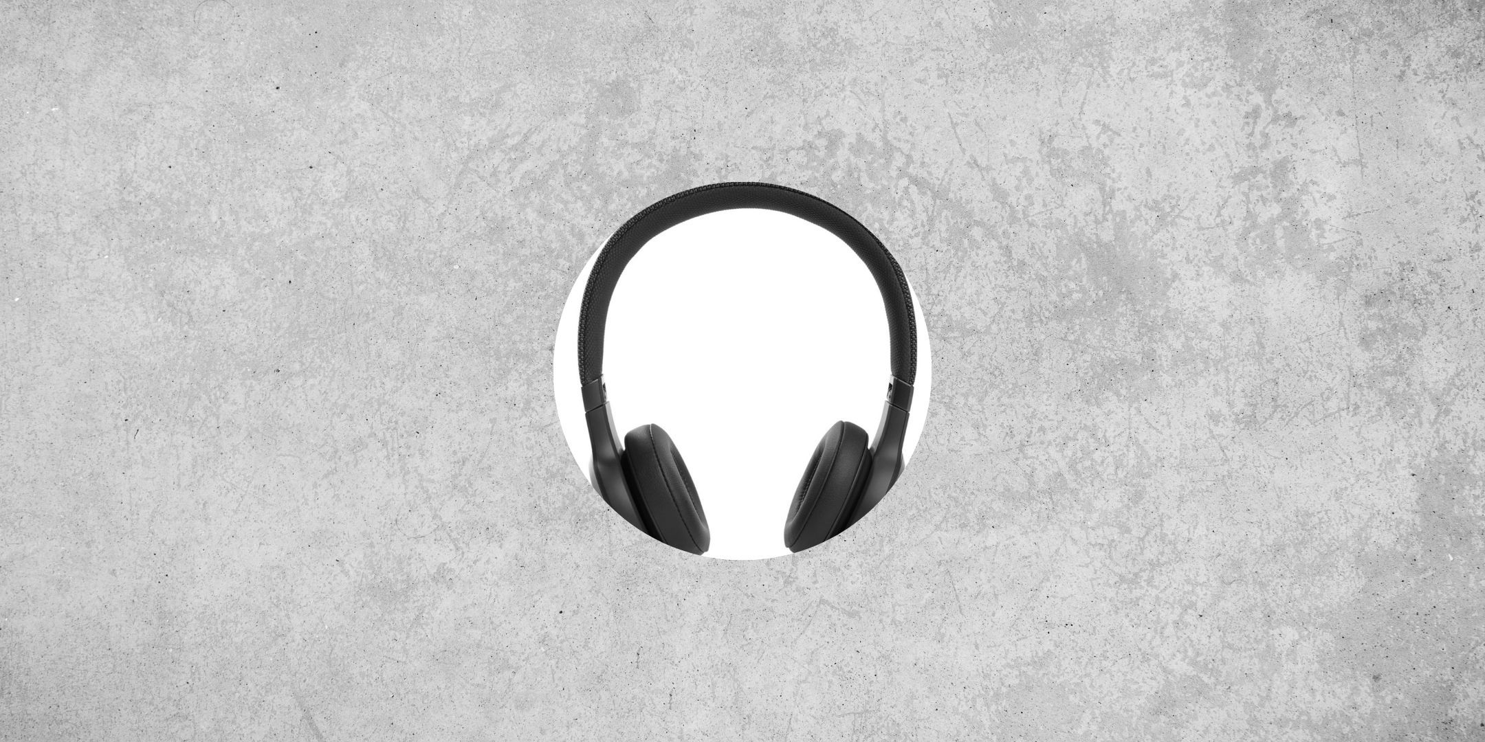 JBL On-ear Headphones against a gray, cement-like background.