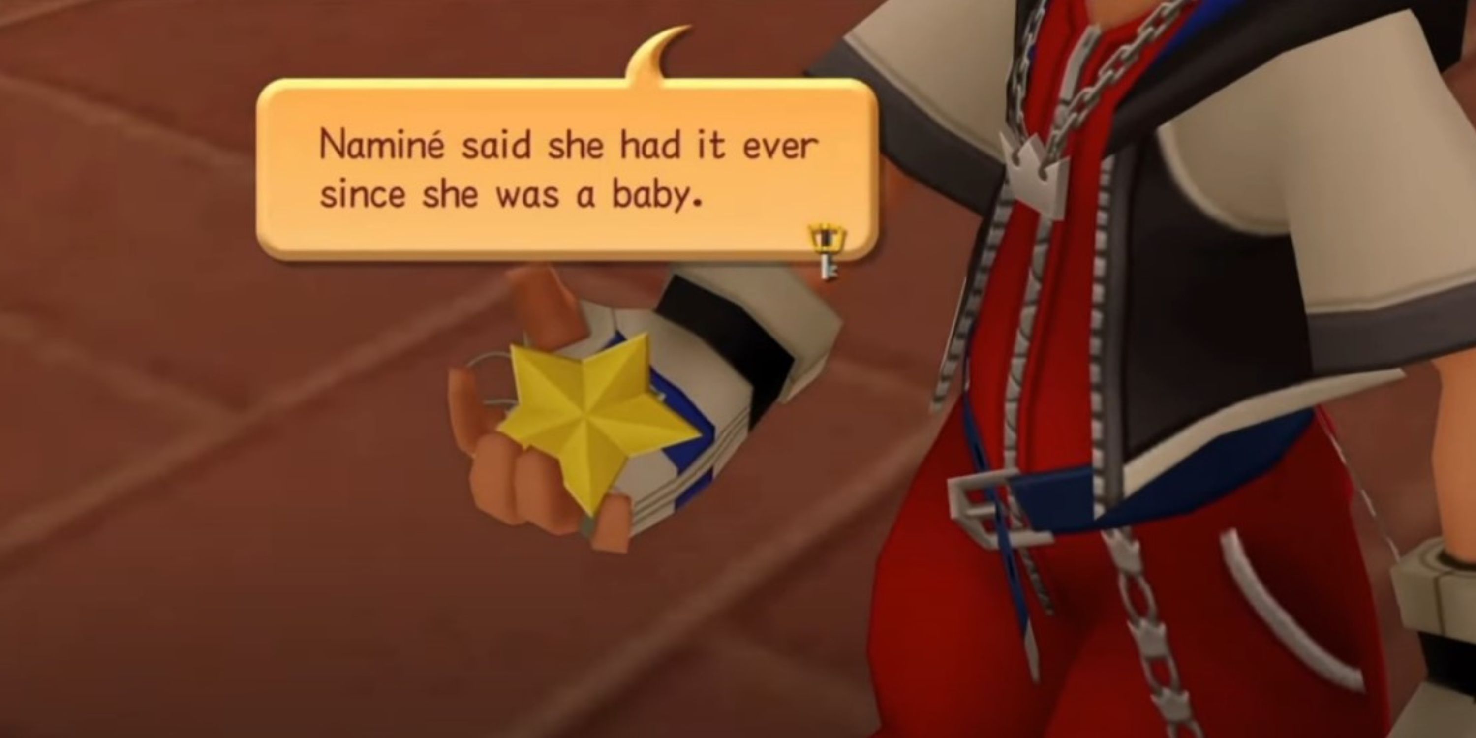 Sora holding the paopu fruit charm in Kingdom Hearts Chain of Memories