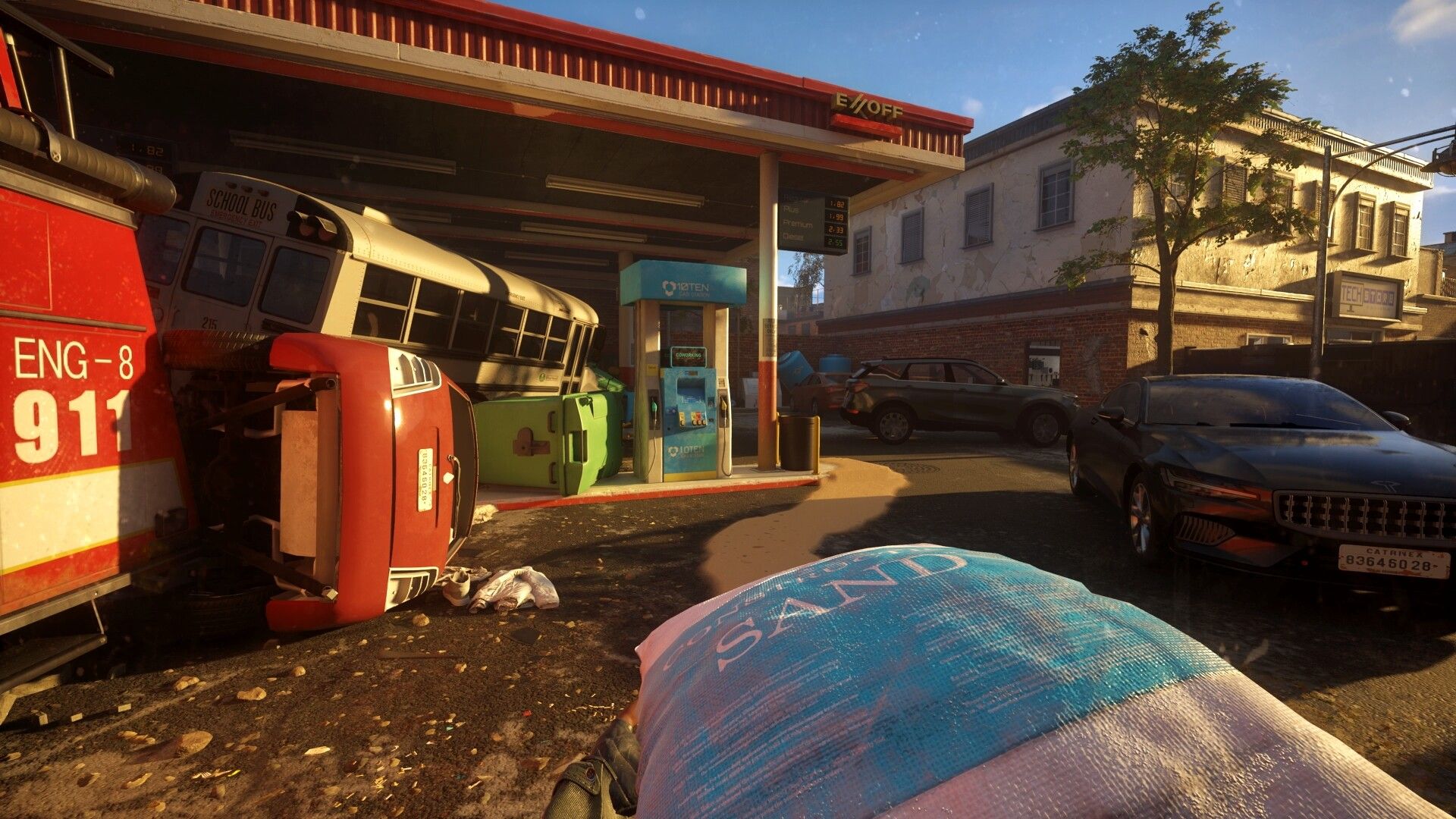 A Quiet Place - The Road Ahead - carrying sand outside of a destroyed gas station