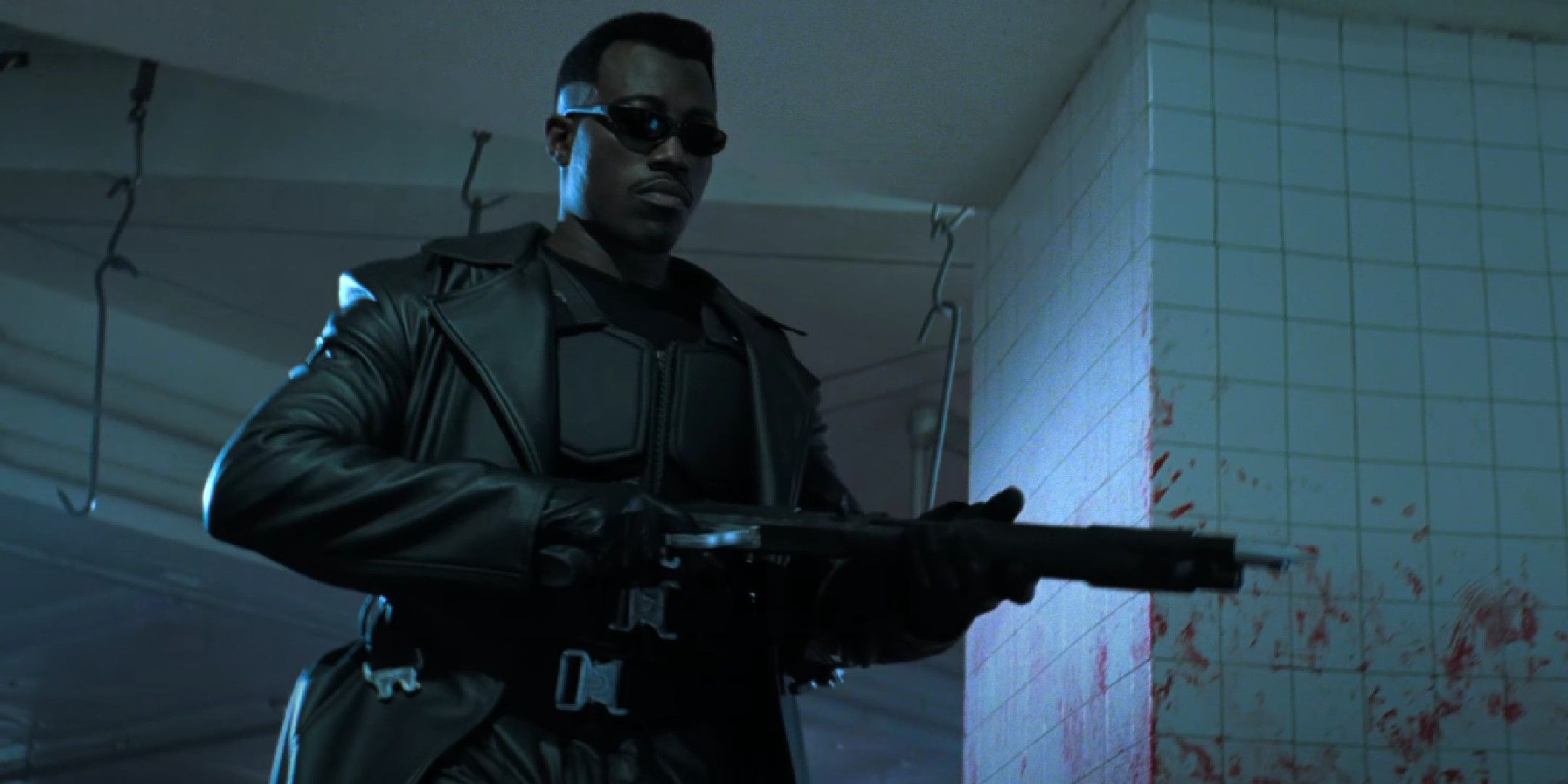 Blade movie image showing the titular character wielding a shotgun.