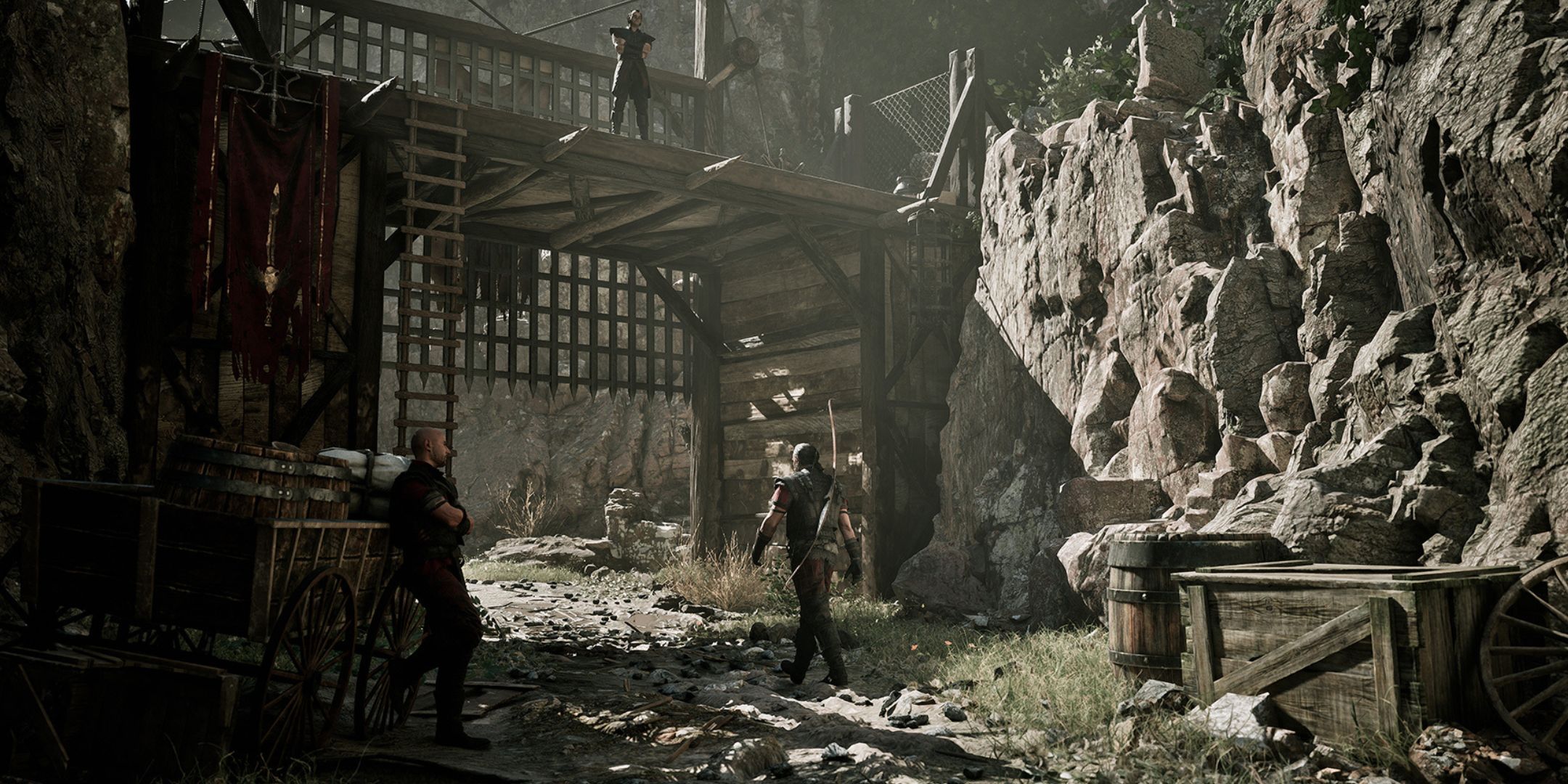 A screenshot from Gothic 1 Remake, showing a run down wooden structure on muddy terrain, with one person walking by as two others keep watch