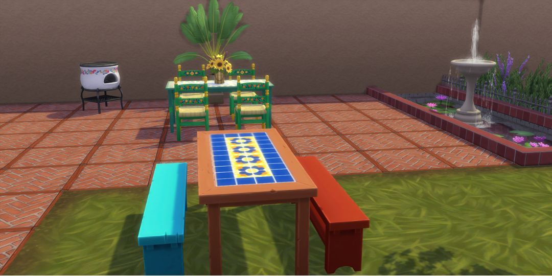 A mosaic picnic table. It has an intricate pattern.