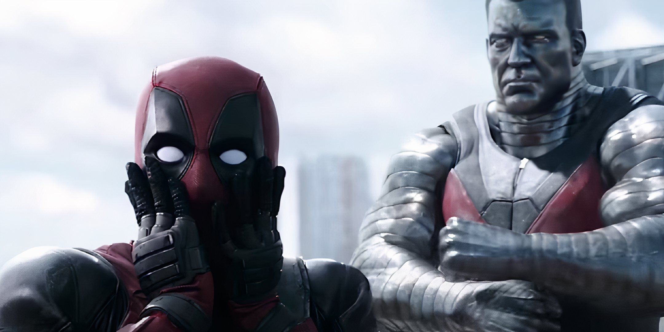 Deadpool movie image showing Deadpool slapping his face with Colossus in the background.