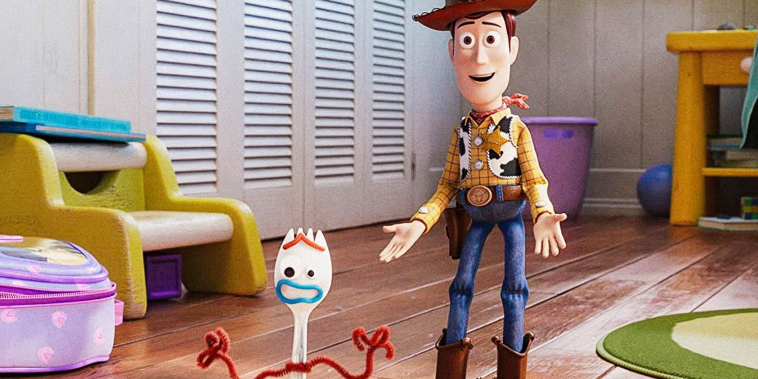 Screenshot from Toy Story movie featuring Woody and Forky holding hands up