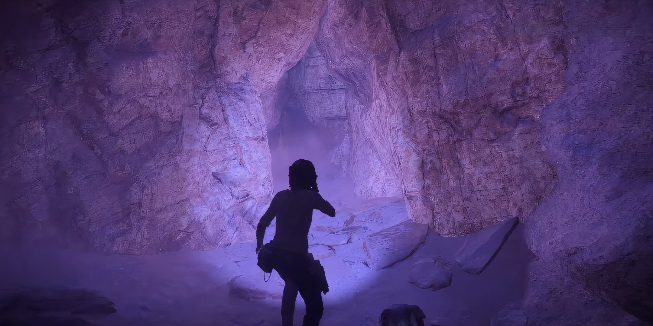 Star Wars Outlaws stealth, kay going through a purple-colored cave