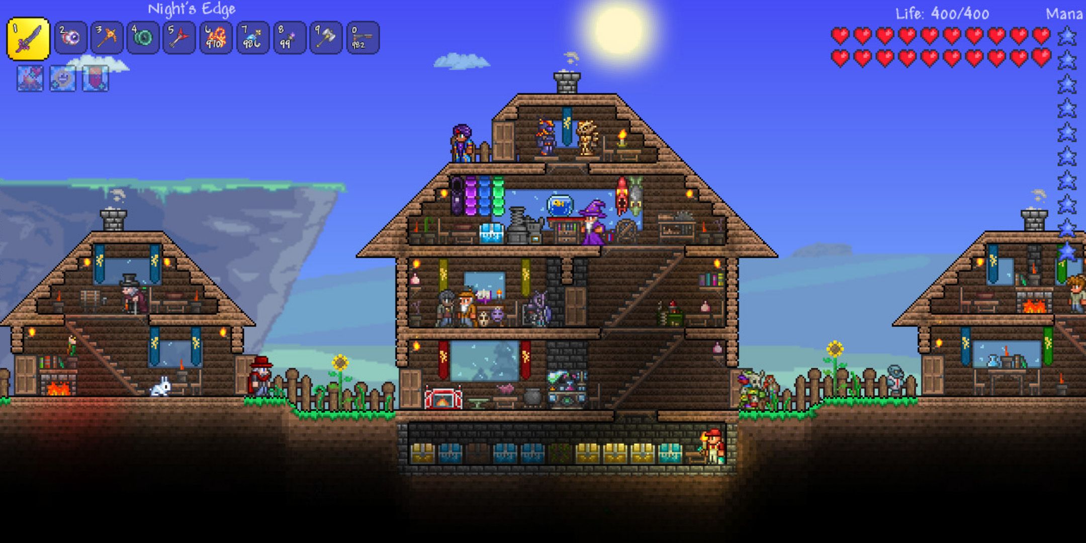 Three houses from Terraria, each packed with people and various furniture.