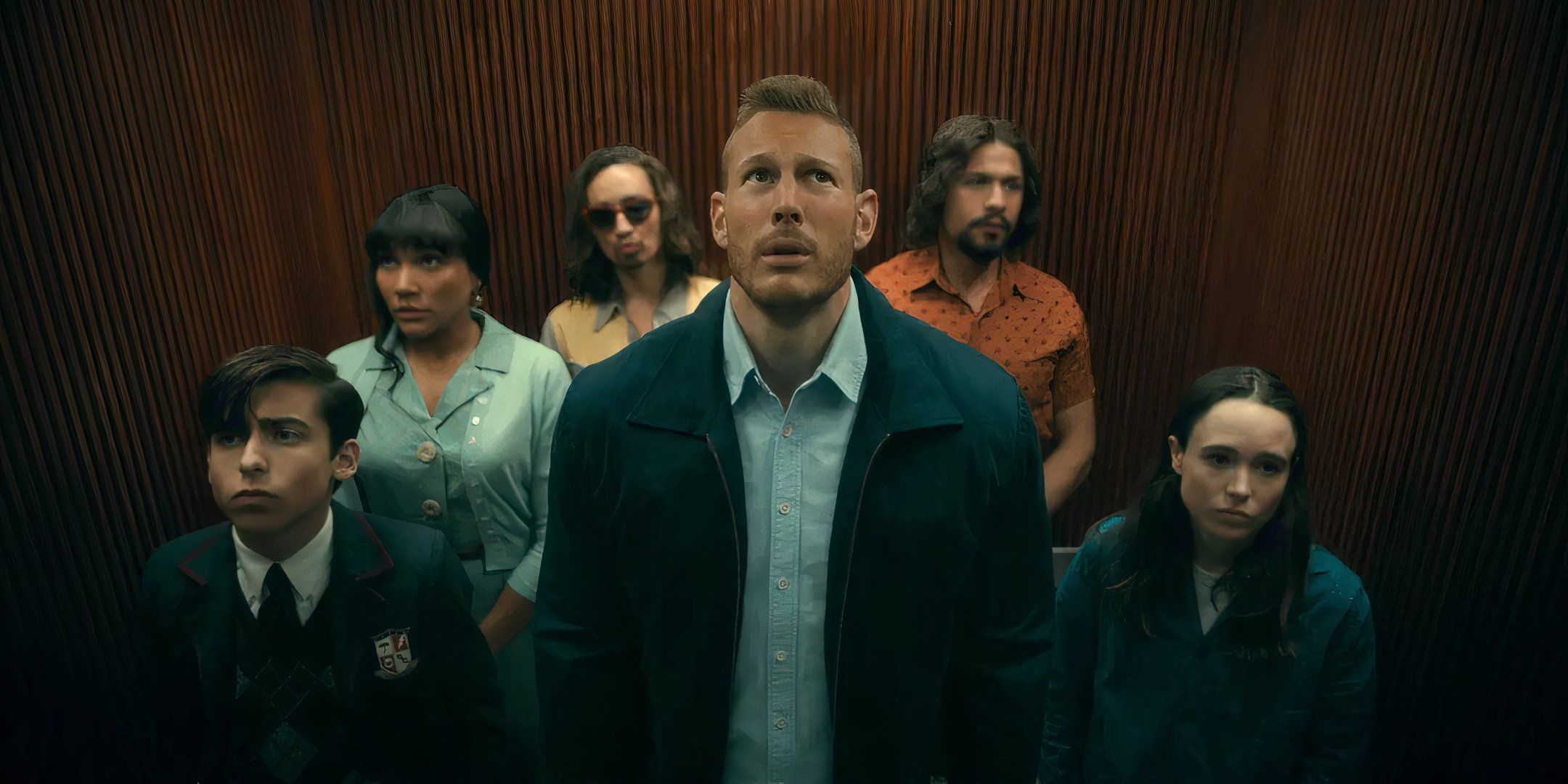 Five, Allison, Klaus, Luthor, Diego and Viktor in an elevator in The Umbrella Academy.