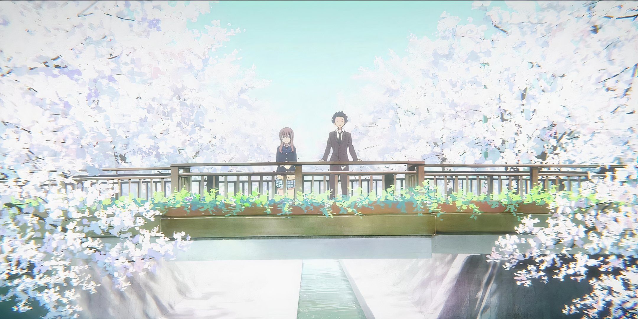 Shouya and Shouko stand together on a bridge. 