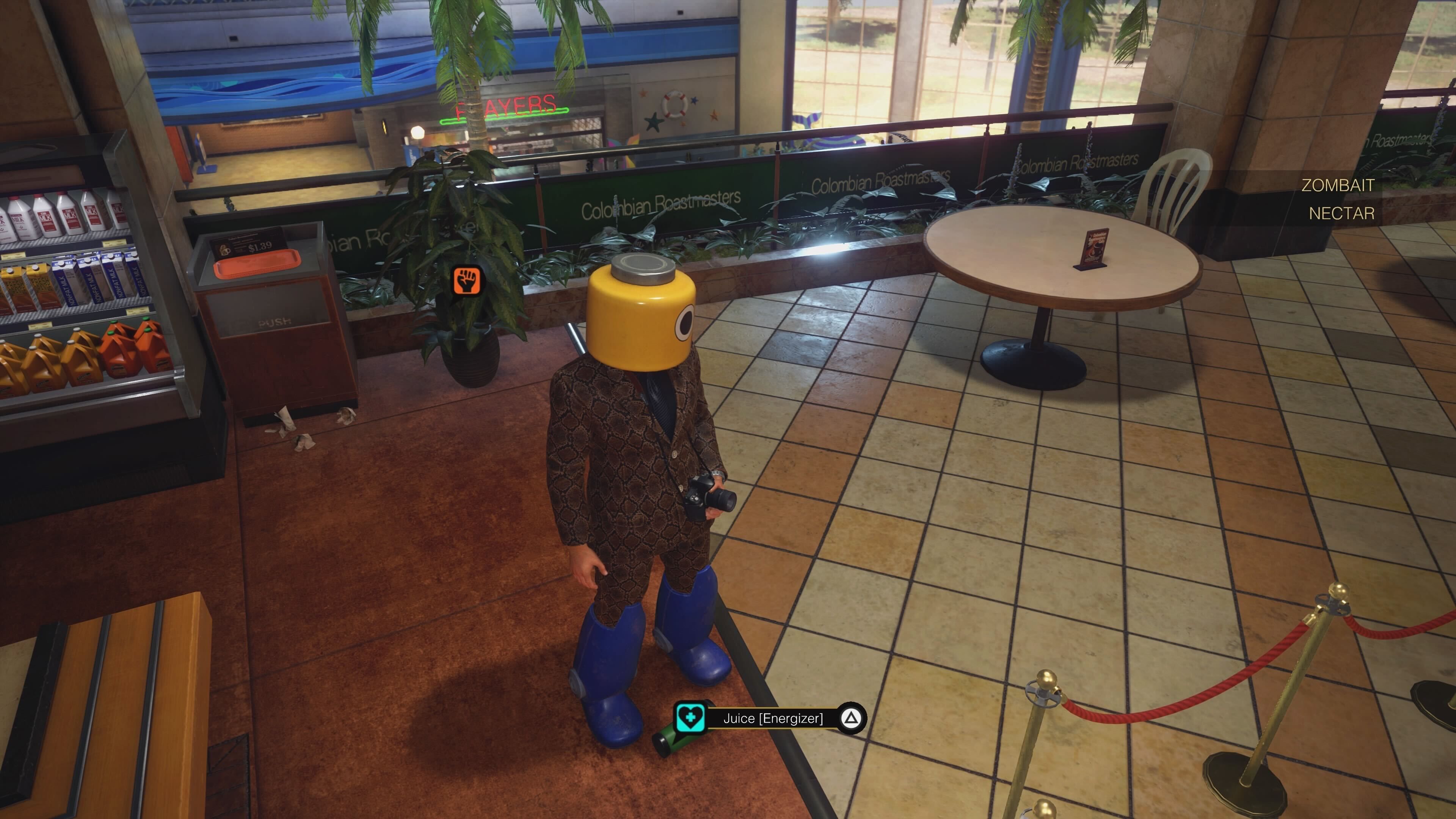 Frank West next to the Randomizer Mixed Juice in Dead Rising Deluxe Remaster.
