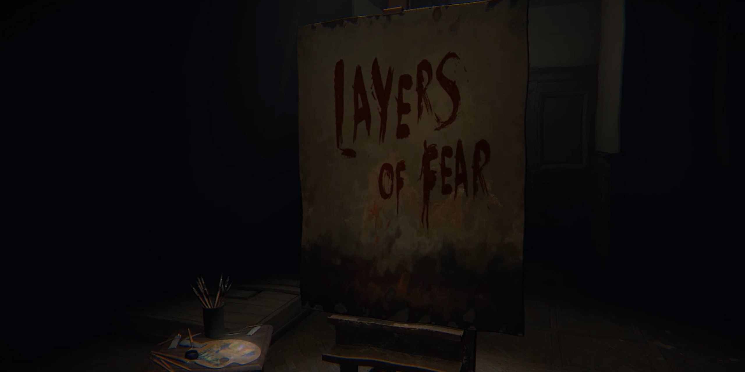 A canvas with the words Layers of Fear written on it in blood.