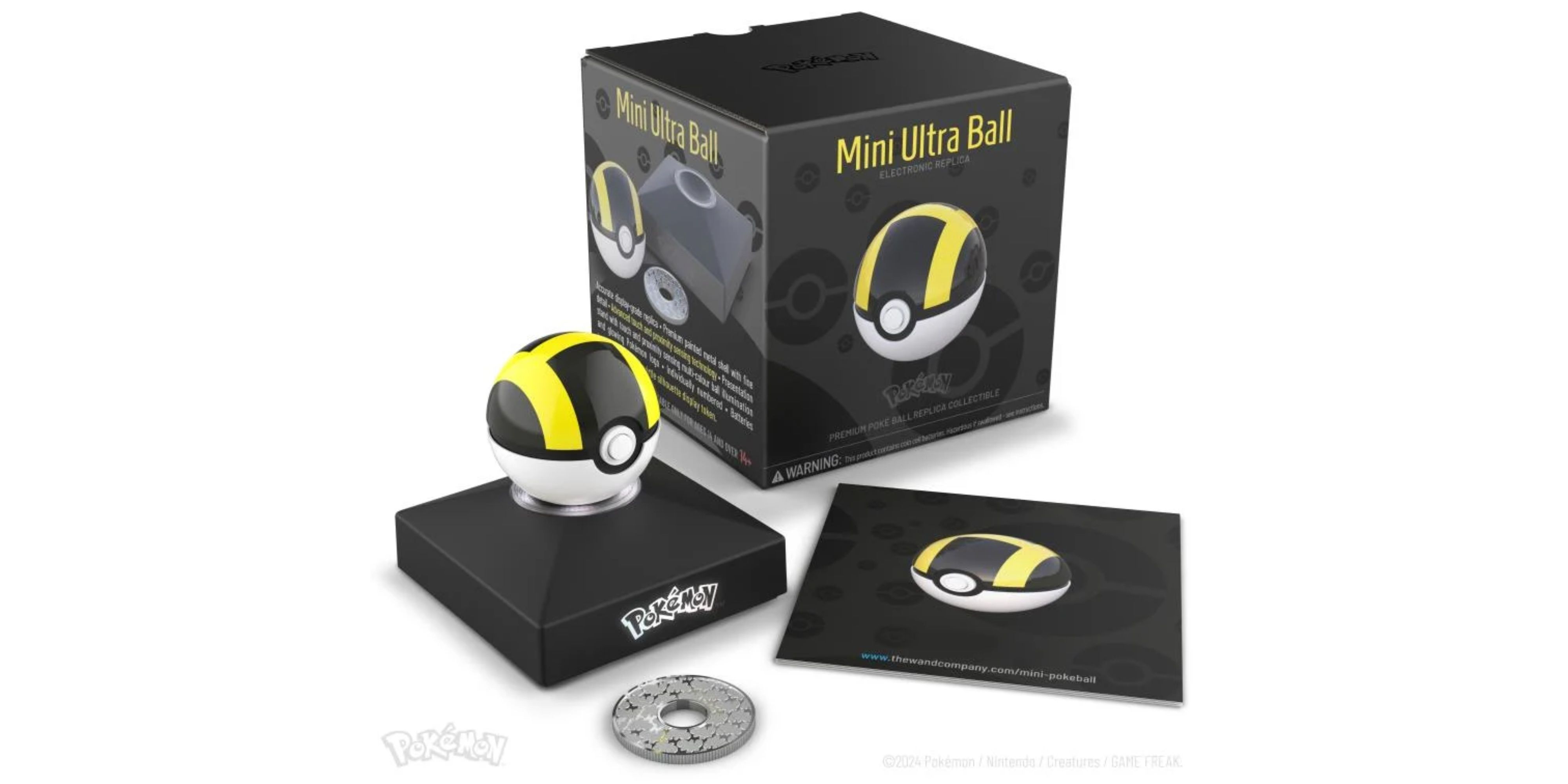 pokemon x the wand company mini ultra ball replica on stand next to its box