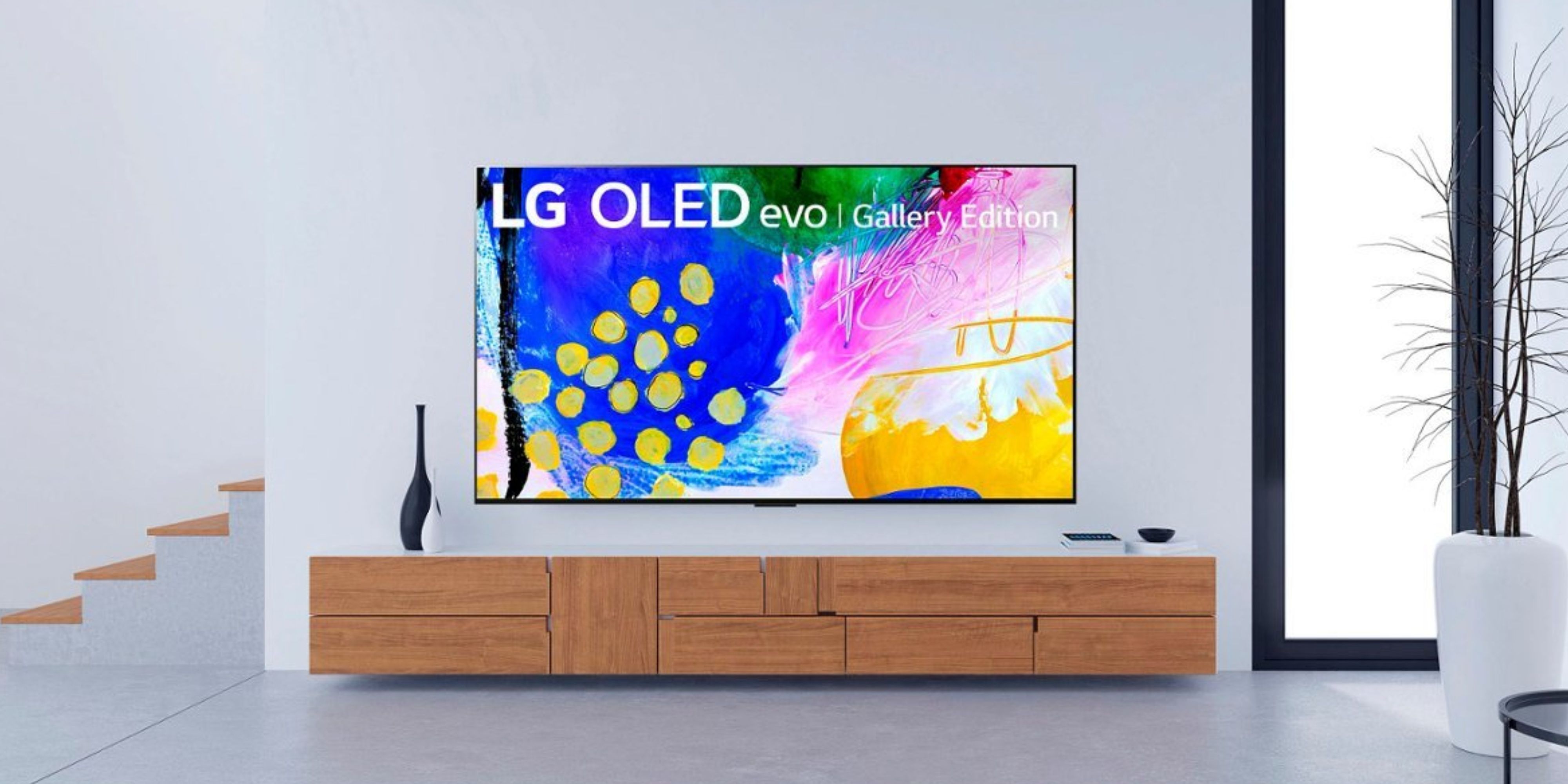 lg 97-inch oled tv on a wall above a cabinet