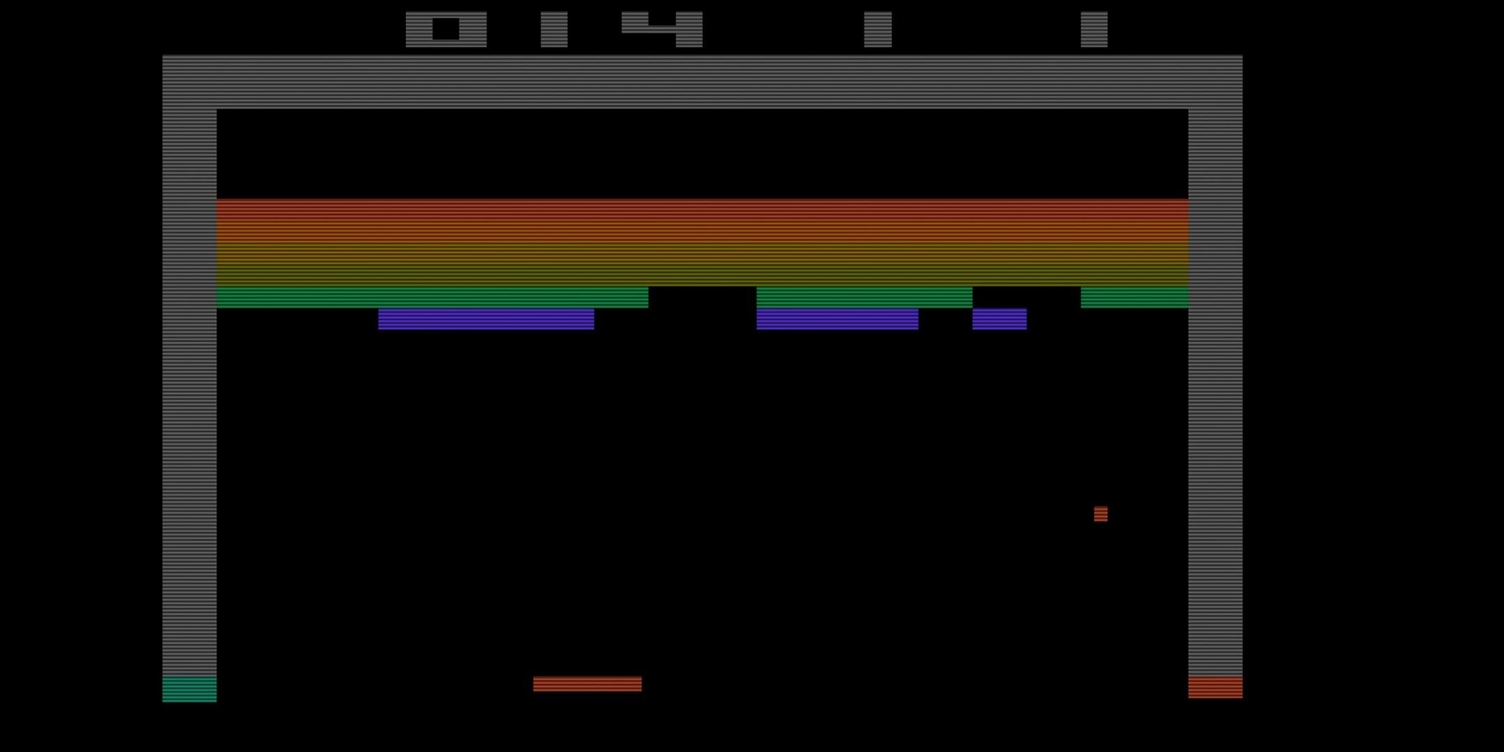 Paddle bouncing a ball to break multi-coloured bricks in Breakout.