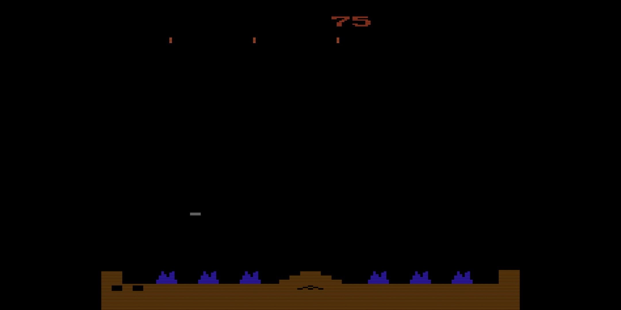 Enemy canons firing at blue cities in Missile Command.