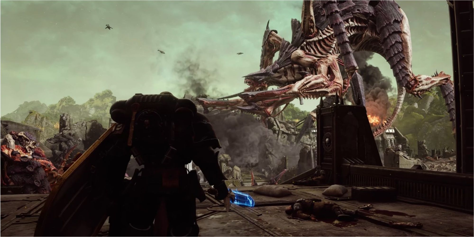 A screenshot of Warhammer 40K: Space Marine 2 showing a Space Marine watching a massive Hierophant Bio-Titan