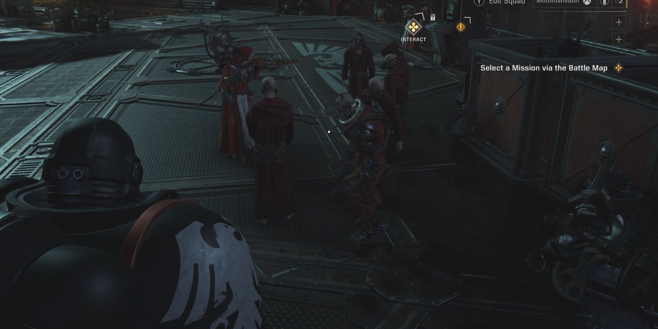 A servitor and tech priests mill about on the deck of a space ship.