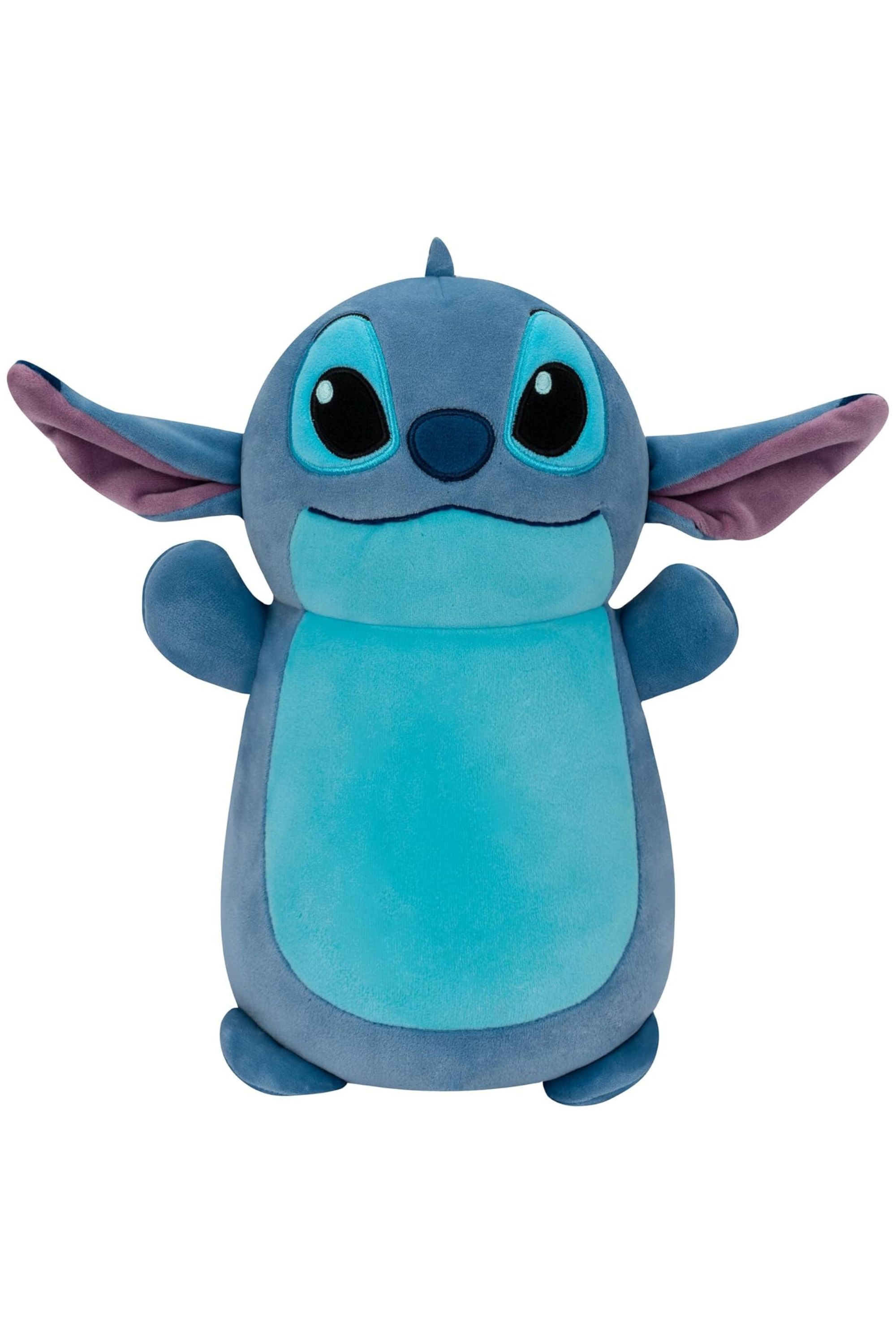 A Stitch Squishmallow Hugmees in front of a white background.